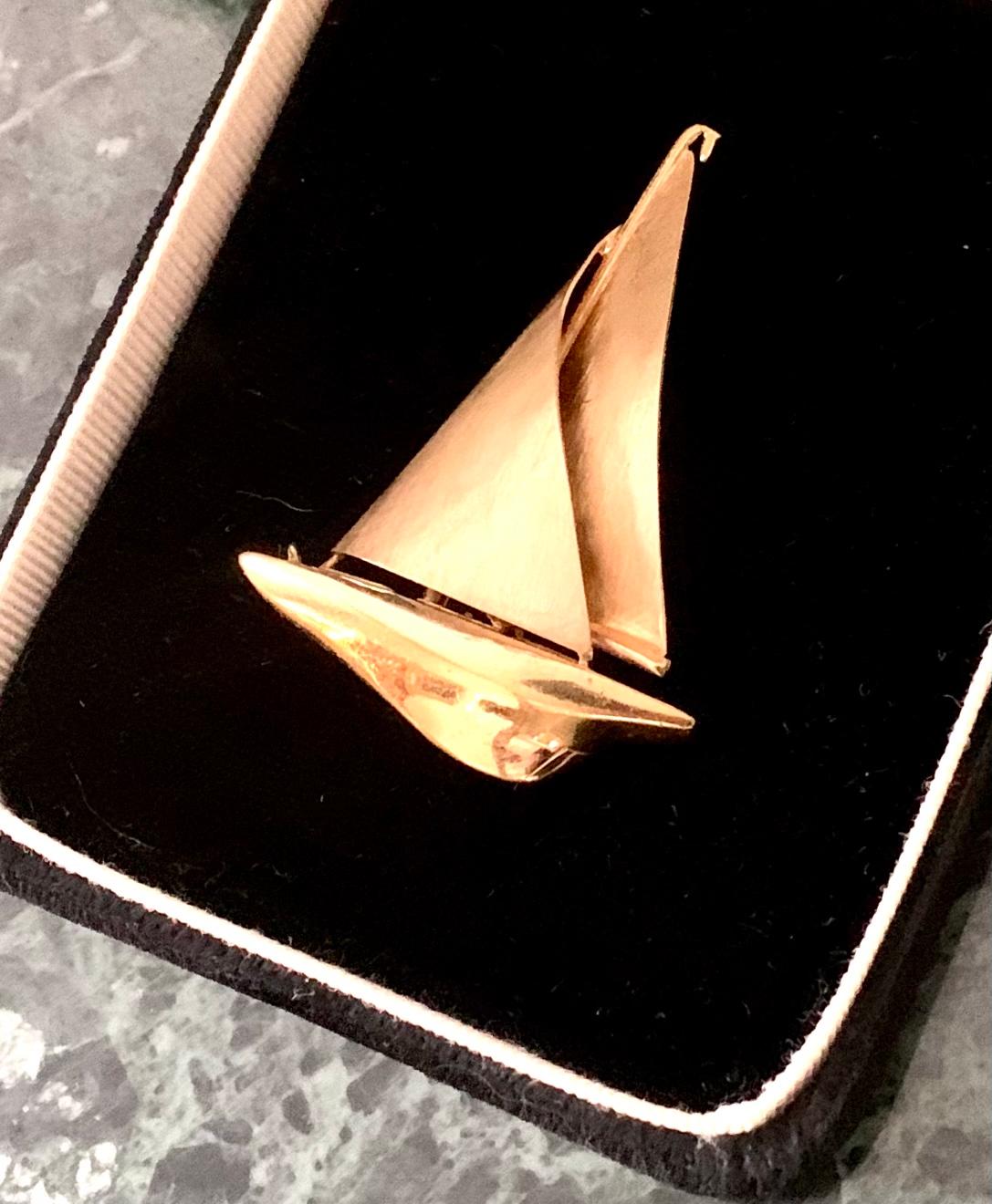 There are some things you can learn best in calm, and some in storm.- Willa Cather
Nautical motifs have inspired some of the greatest minds of our time.

Elegant estate yacht brooch with large textured gold sails and a gleaming body with lovely
