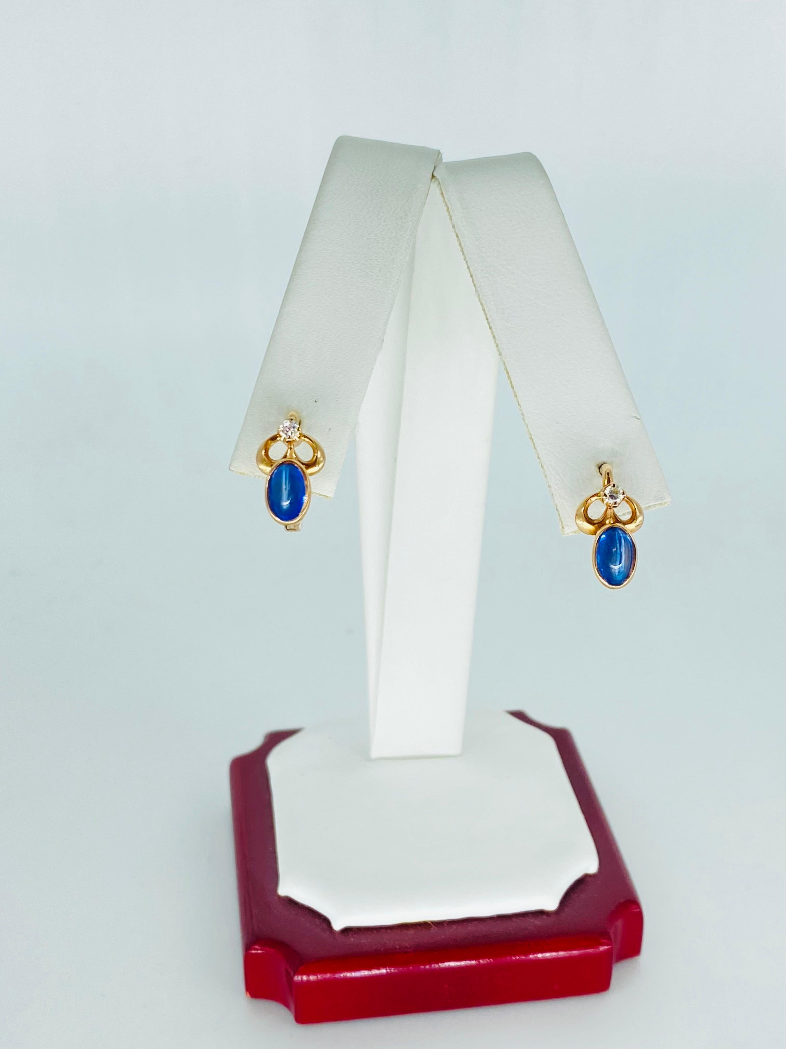 Retro 1.56 Carat Sapphire Cabochon Bezel Set Earrings Russian Gold 14k. The ring is stamped for purity and maker. The earrings feature blue sapphire cabochon cut that measure approx 0.78 carat each by formula for a total of 1.56 carat. The diamonds