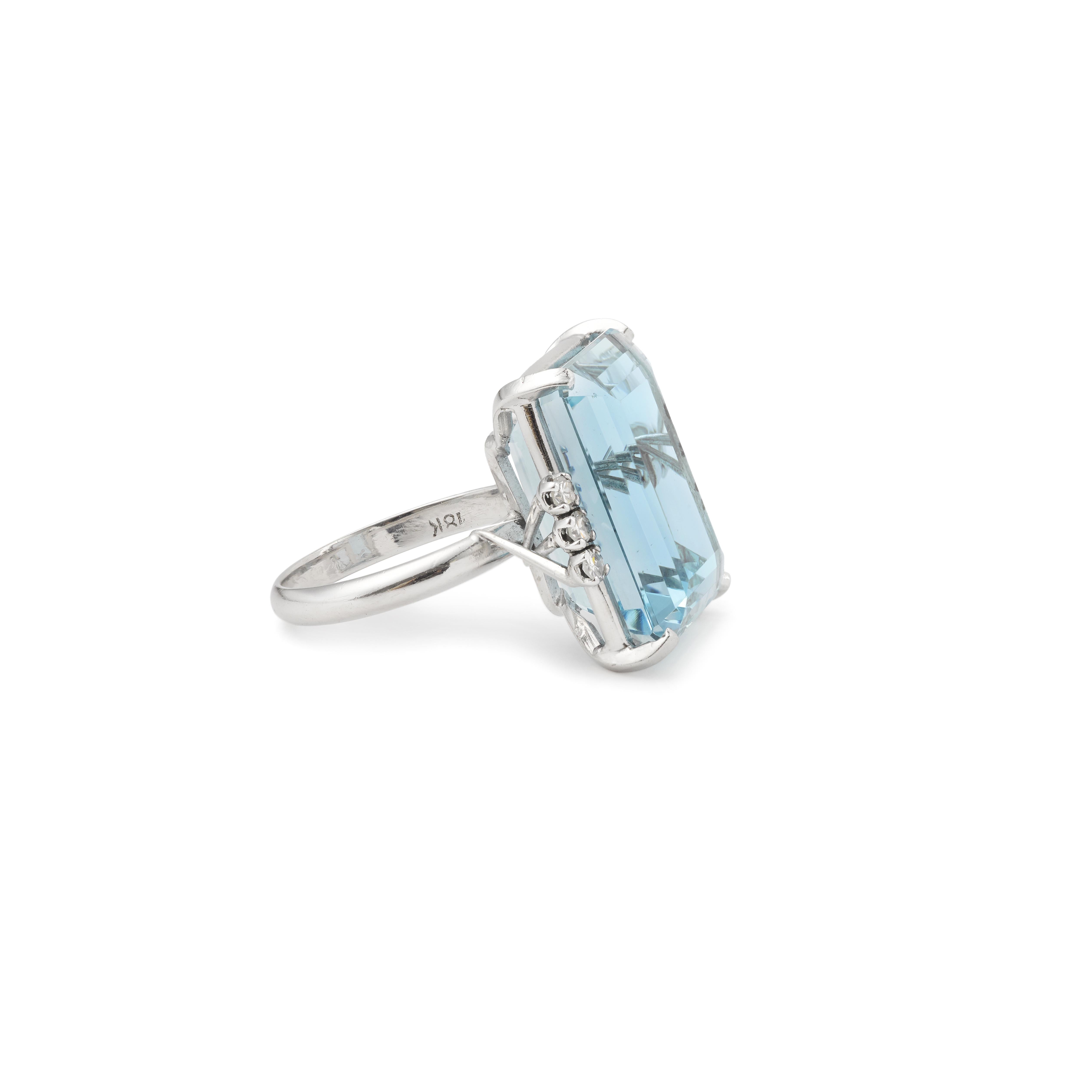 Stunning 18K Gold 16.5 ct Aquamarine 6 Diamonds Cocktail Ring

This gorgeous 16.5 carat deep blue emerald faceted cut aquamarine ring has excellent color and is eye cleaned, set with 6 lovely brilliant cut diamonds of white color and good clarity,