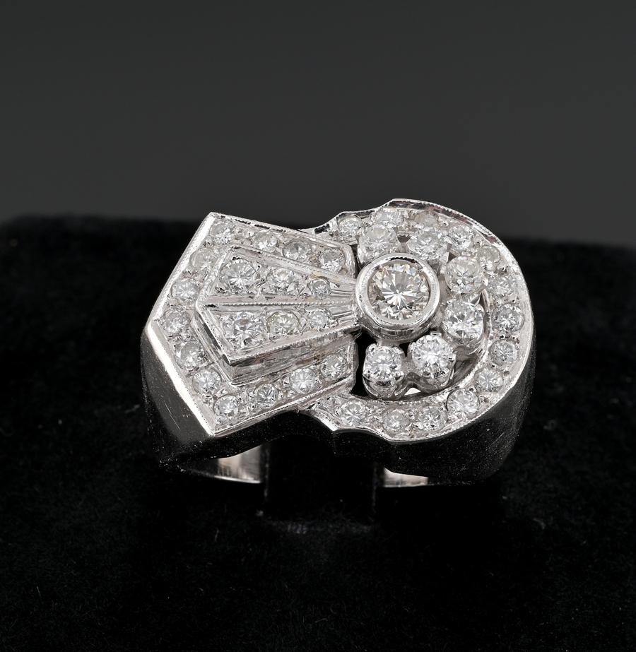 Excellent Art Deco Diamond Buckle ring
We are pleased to be offering this truly Fabulous genuine Art Deco ring in fascinating buckle design as widely in auge during the period
This is a huge and bold ring very finely hand crafted during the 30’s