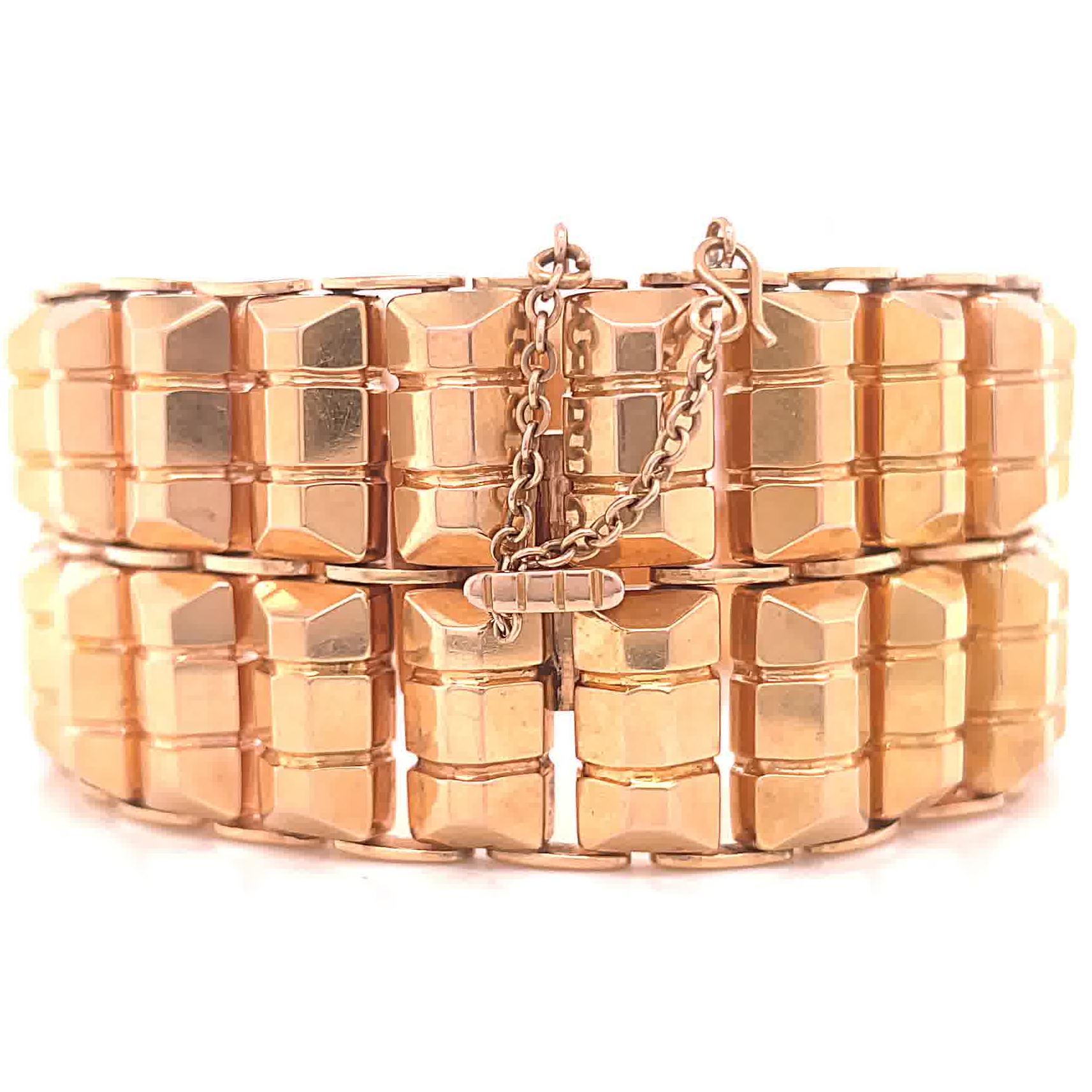 Retro 18 Karat Rose Gold Tank Bracelet. Circa 1940's. 7 1/4 inches. 

About The Piece: Do you like a bold gold look? You're in luck because substantial gold pieces are the hottest trend of the new decade. This bracelet is solid, confident and