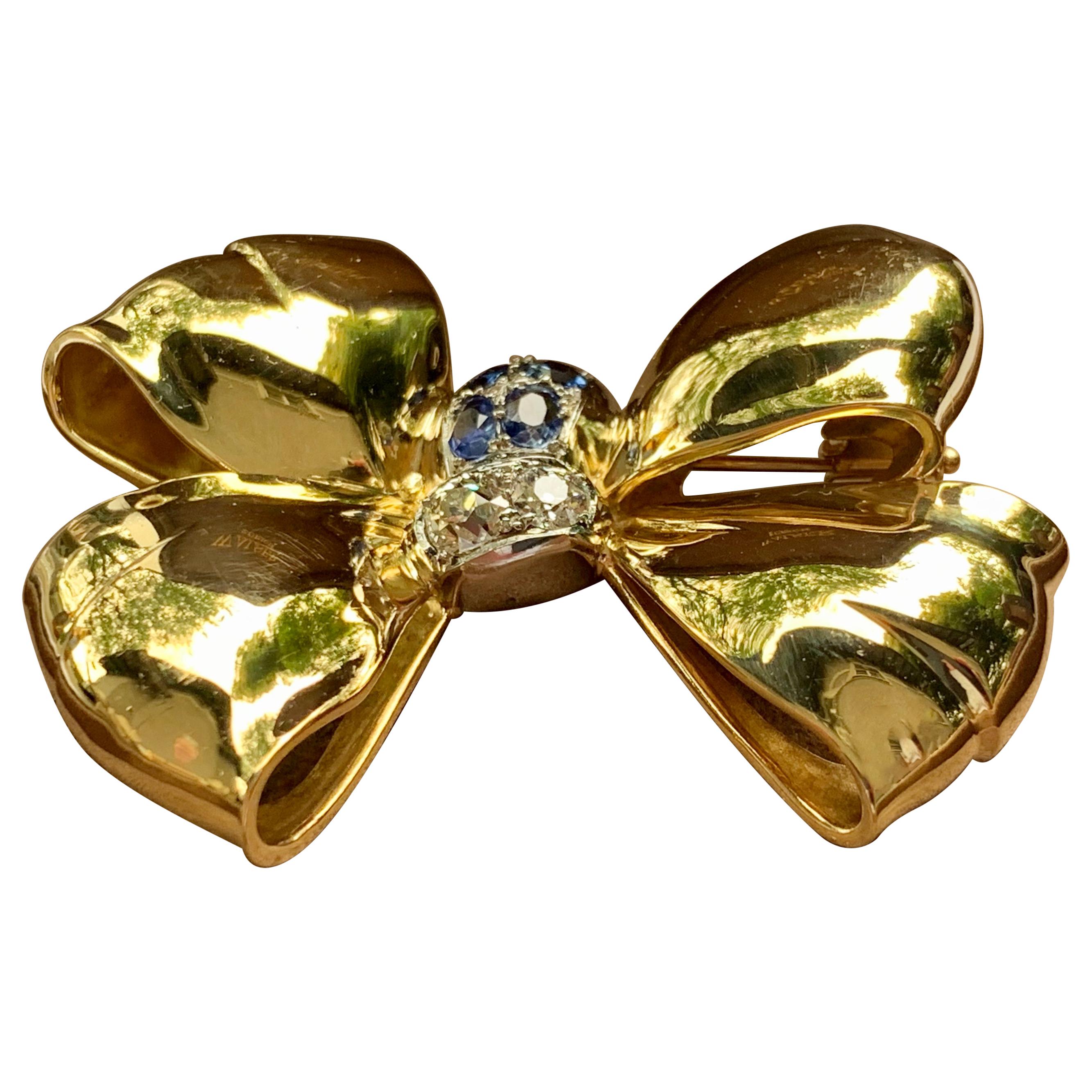 Retro 18 karat Yellow Gold Bow Brooch With Sapphires And Diamonds