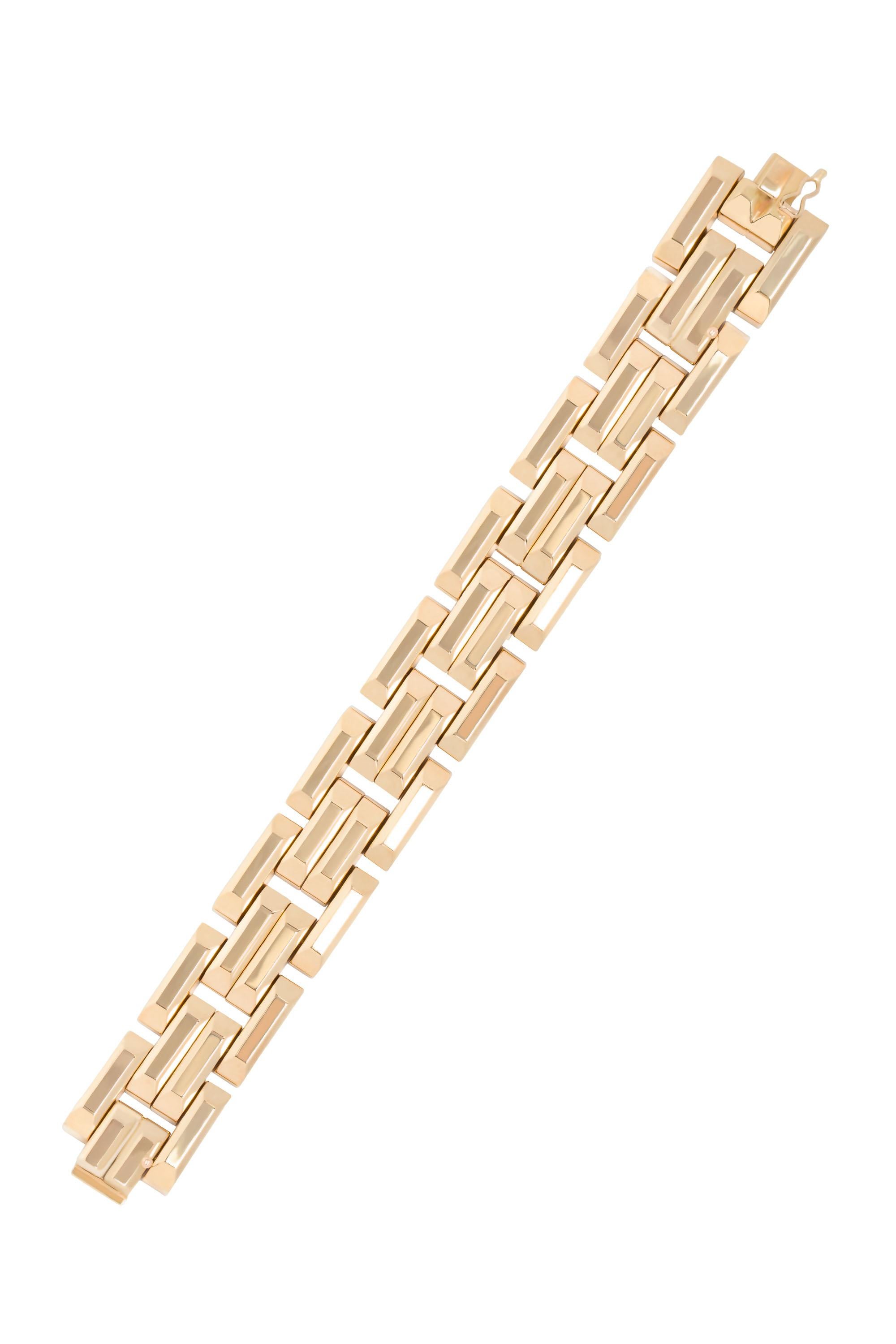 Rendered in stylized links of gleaming 18 karat yellow gold, this bracelet exemplifies the bold glamour of the 1940s. Measures 8” in length. 