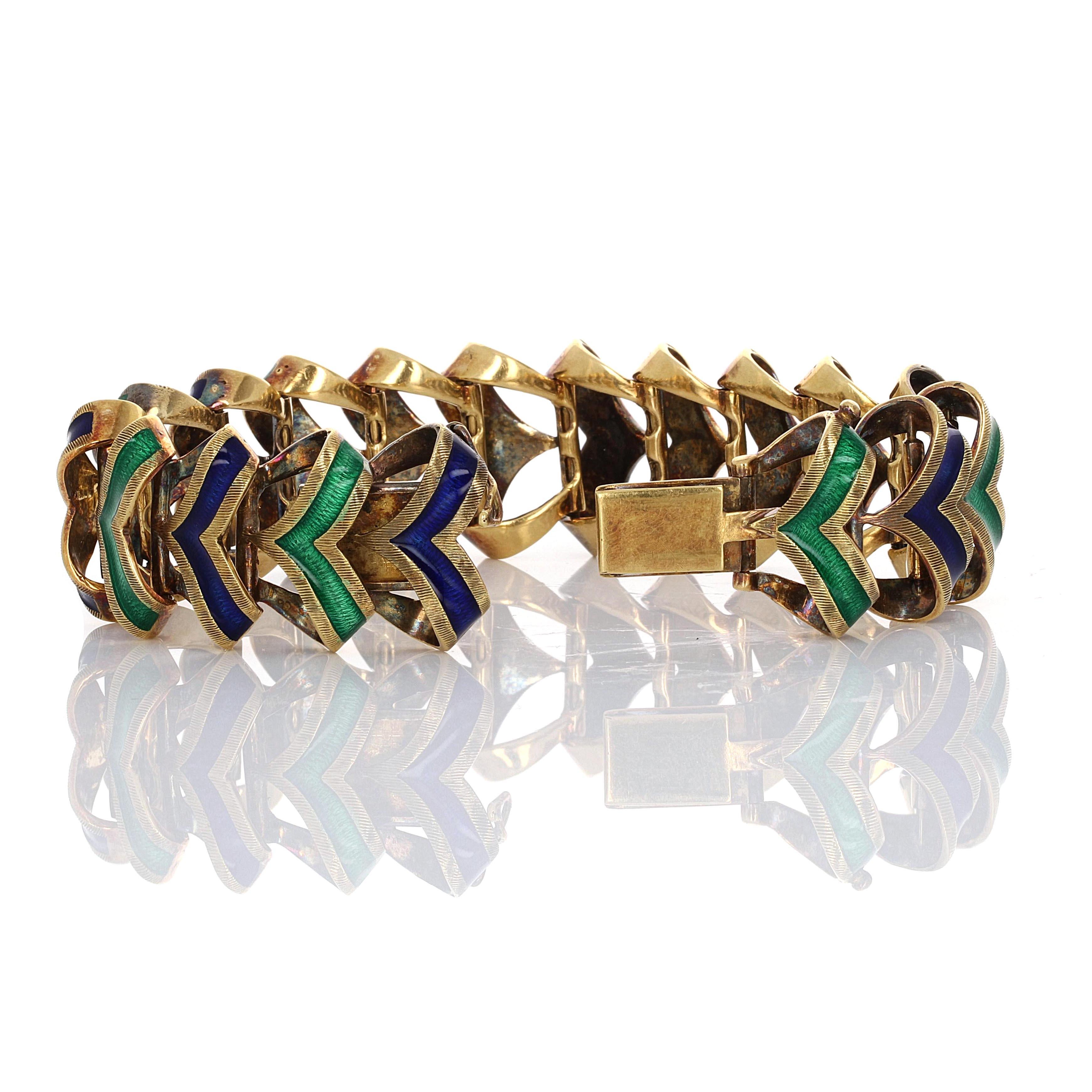 1960's, two tone enamel link 18 karat yellow gold bracelet. The beautiful enamel links alternate in color, emerald green and cobalt blue. The bracelet is hand crafted with a woven braid chevron design. 

Bracelet is 7 inches in length and 7/8 inch