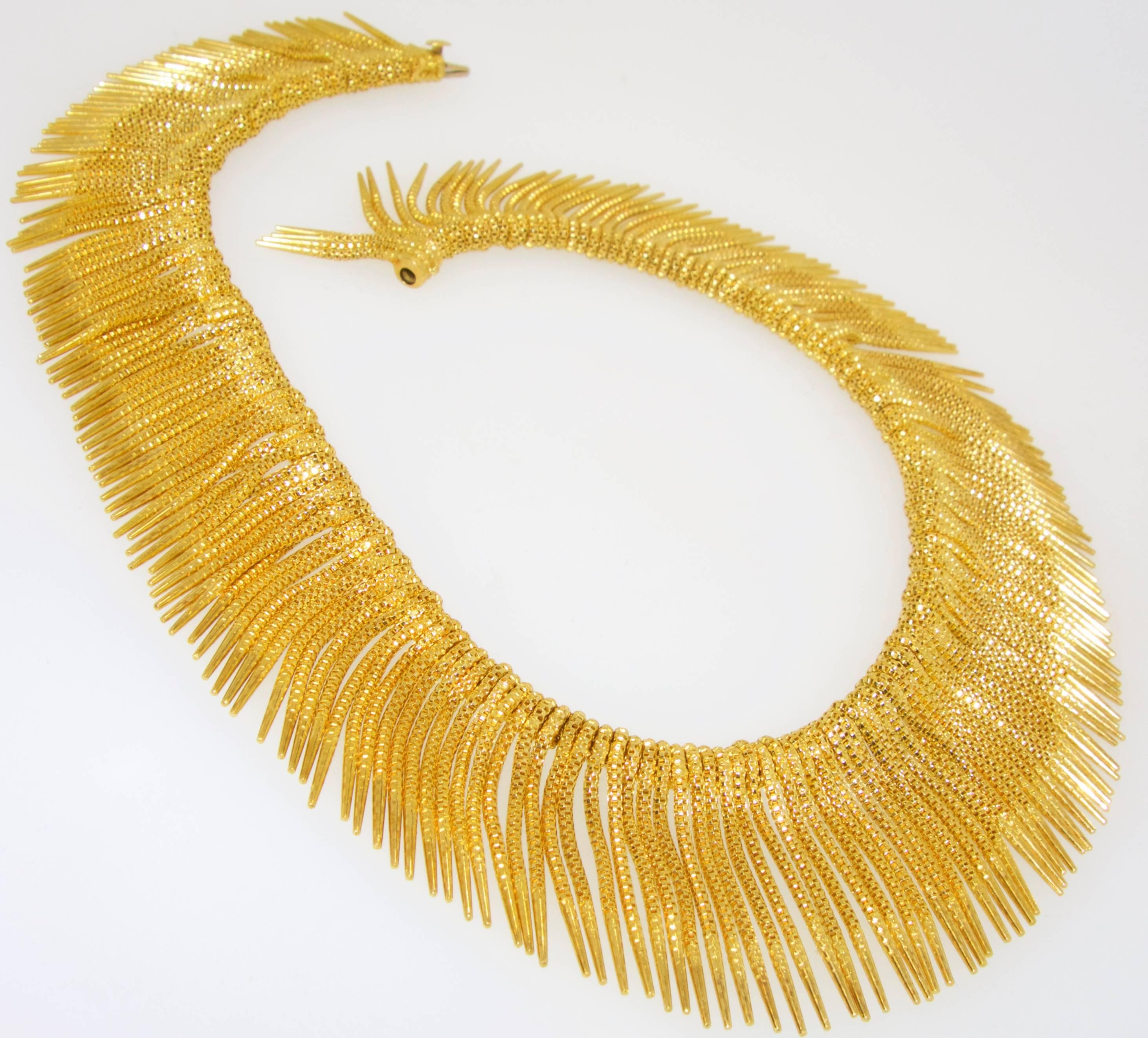 18K yellow gold weighing 93.5 dwts, 145.41 grams, this 15 inch necklace which is to be worn right at the neckline is quite unusual and the first time we have seen this design.  Finished with a barrel type clasp, the fringe is slightly graduated with
