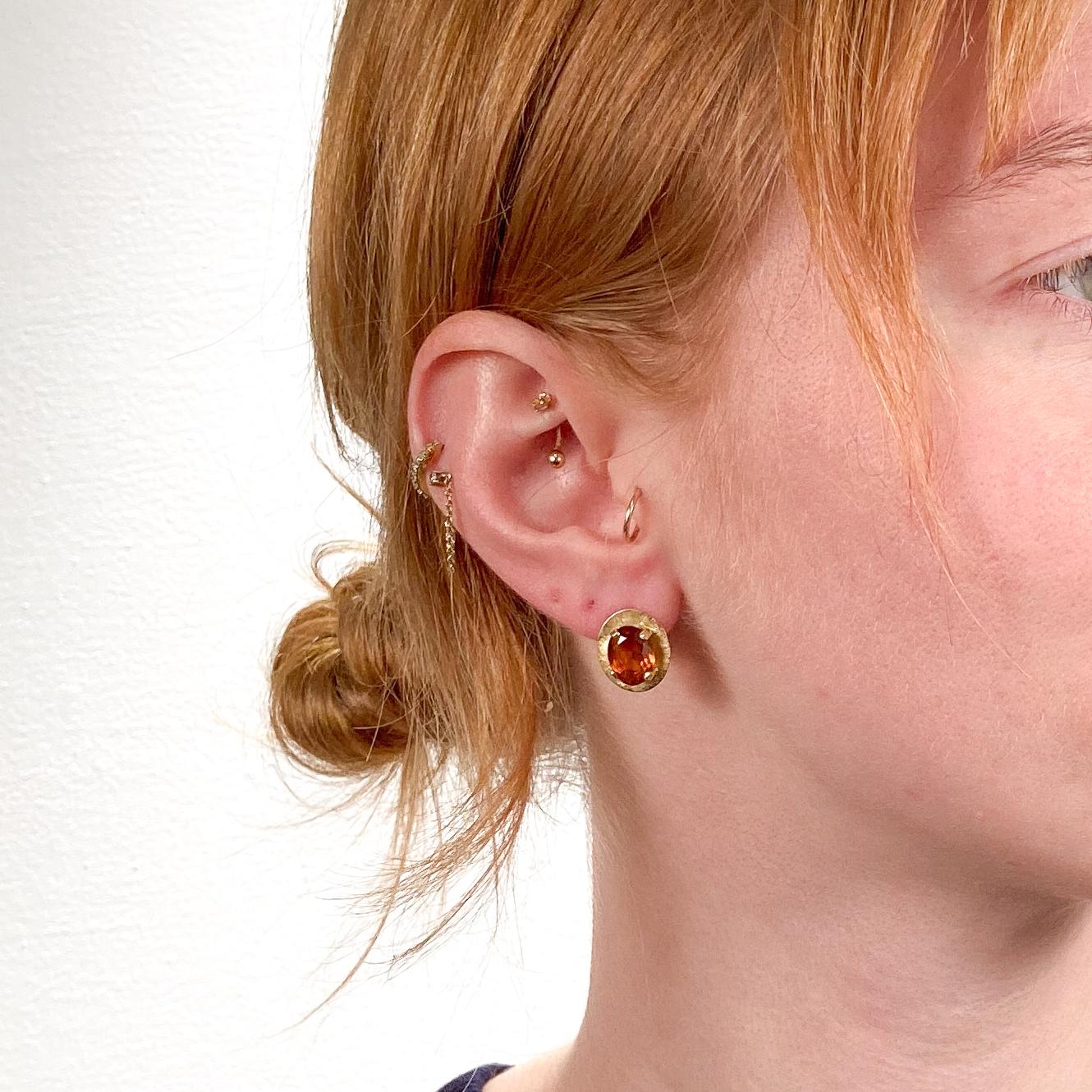 A fine pair of 1980's style earrings.

In 18 karat yellow gold.

Prong-set with oval cut madeira citrine gemstones with a Florentine finish.

Simply a wonderful pair of 80's style earrings!

Date:
20th Century

Overall Condition:
It is in overall