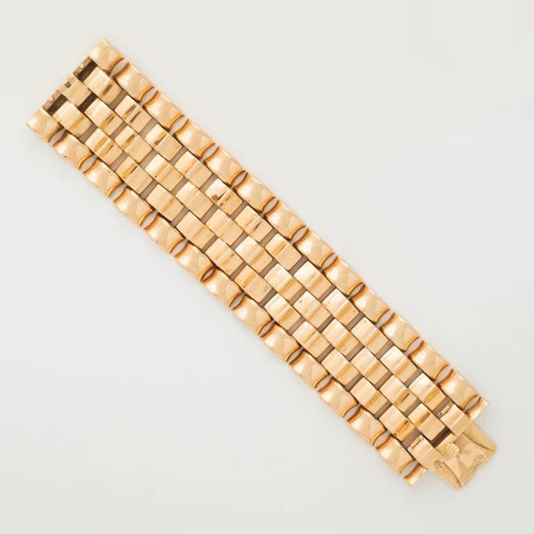 Retro 18K Rose Gold Tank Bracelet c.1940s

Additional Information:
Period: Retro
Year: 1940s
Material: 18k Rose Gold 
Weight: 111.2g
Length: 17cm/6.7 inches
Width: 36.61mm
Condition: Pristine Vintage