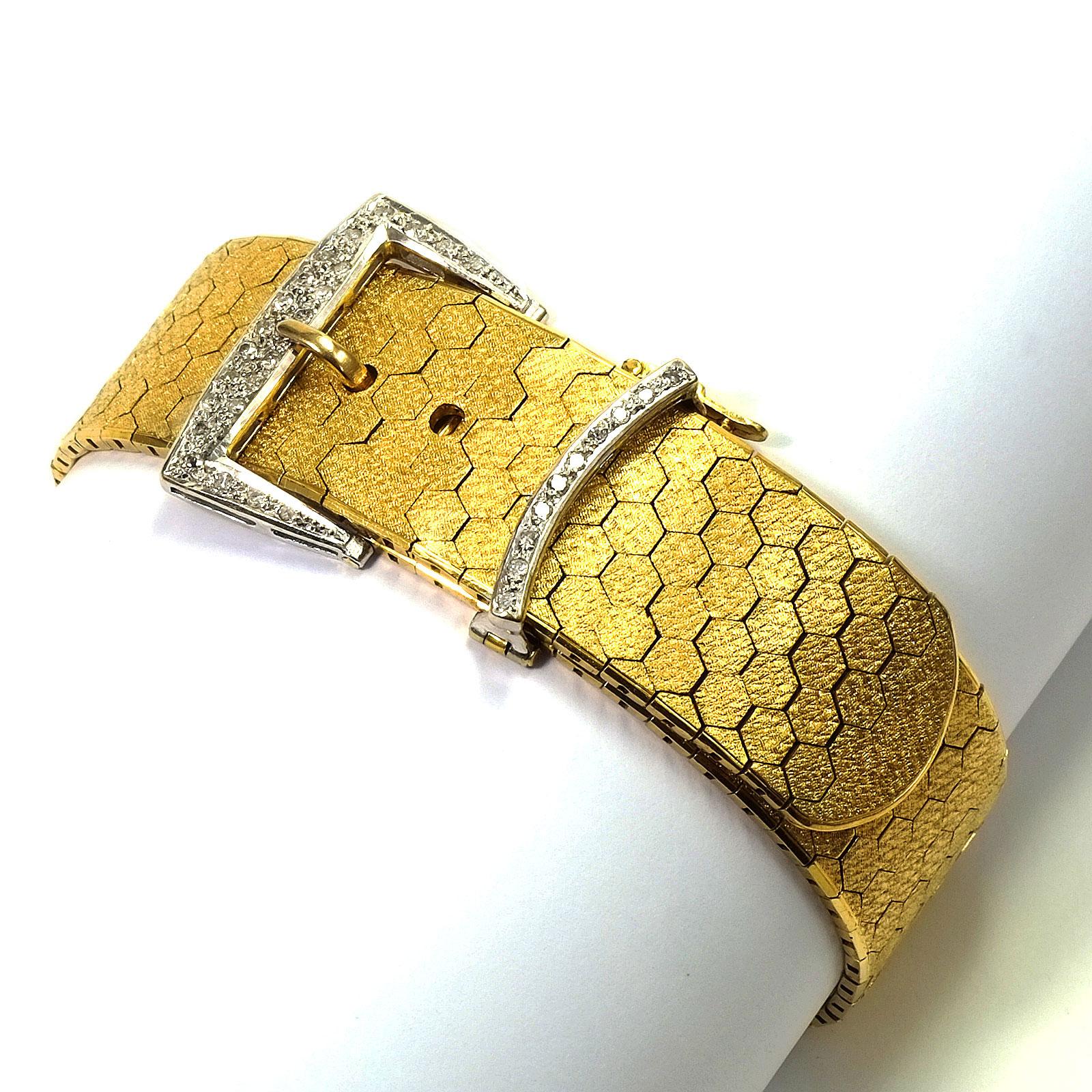 Retro 18 K yellow gold and 0.32 carat diamond buckle Bracelet circa 1940

Inspired by the world of couture, this elegant Retro buckle bracelet is designed as an adjustable belt. The supple gold band with a satin honeycomb pattern is made of solid