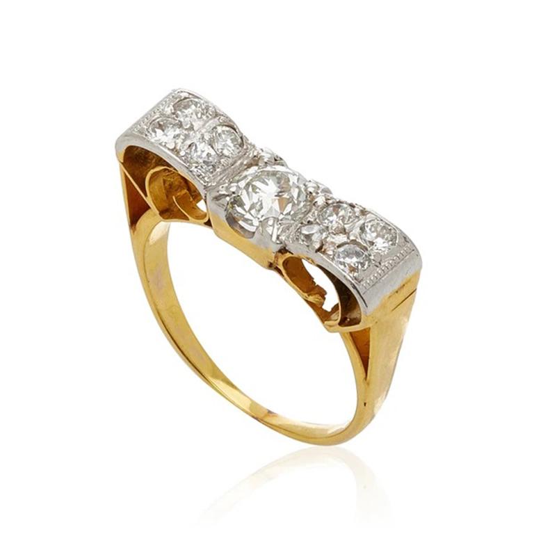 Retro 18K Yellow Gold And Platinum And 1.50Cts. Diamond Bow Ring C.1940S

Additional Information:
Period: Retro
Year: c.1940s
Material: 18k Yellow Gold, Platinum and 1.50cts. Diamonds
Weight: 4.31g
Size: 7.5
Condition: Pristine Retro