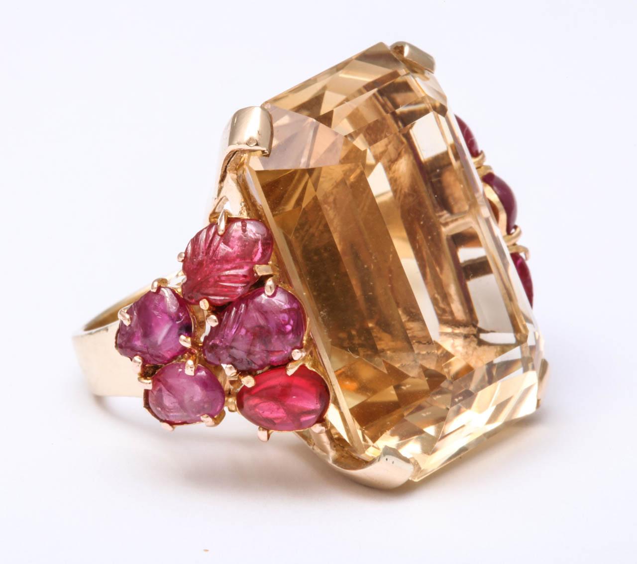 Impressive citrine and carved ruby ring, US size 7.25. Citrine weight is approx. 48ct. The weight is 26.3 grams.