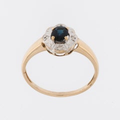 Retro 18 karat Gold Ring with Diamonds and Sapphire