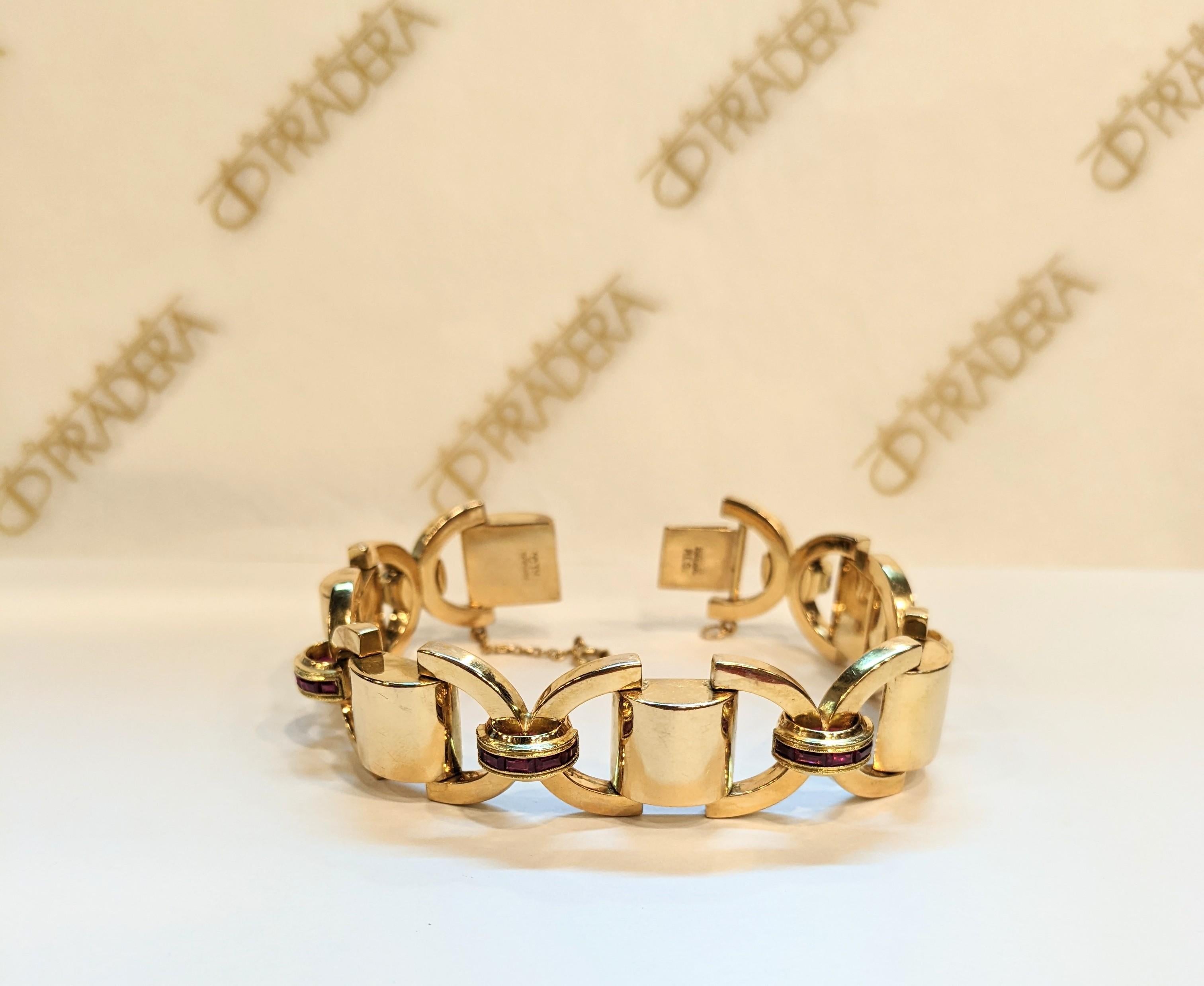 This beautiful Chevalier epoque  1940's clips can be worn separately or together by its custom fitting. 
The diamond and gold ribbon swirl iand nests ruby colored gems. The brooch is 18k rose gold  and fitting is 18k white gold. 
Can be used in