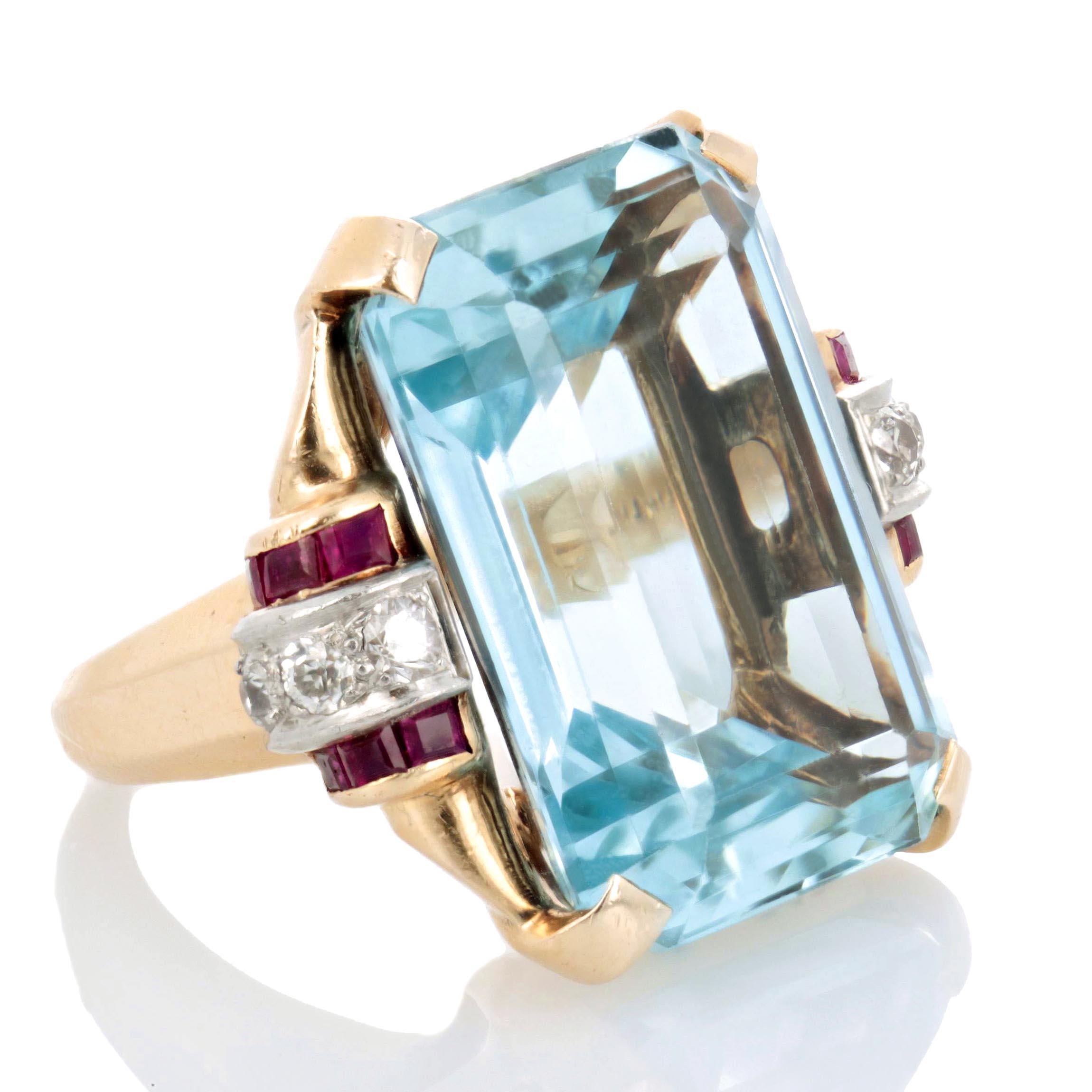 Set with an emerald-cut aquamarine weighing approximately 24 carats, with old-cut diamonds and calibré-cut ruby accents on both shoulders, mounted in platinum and 14K yellow gold.  Circa 1940 size 4.75.

* More photos by request
* FREE shipping