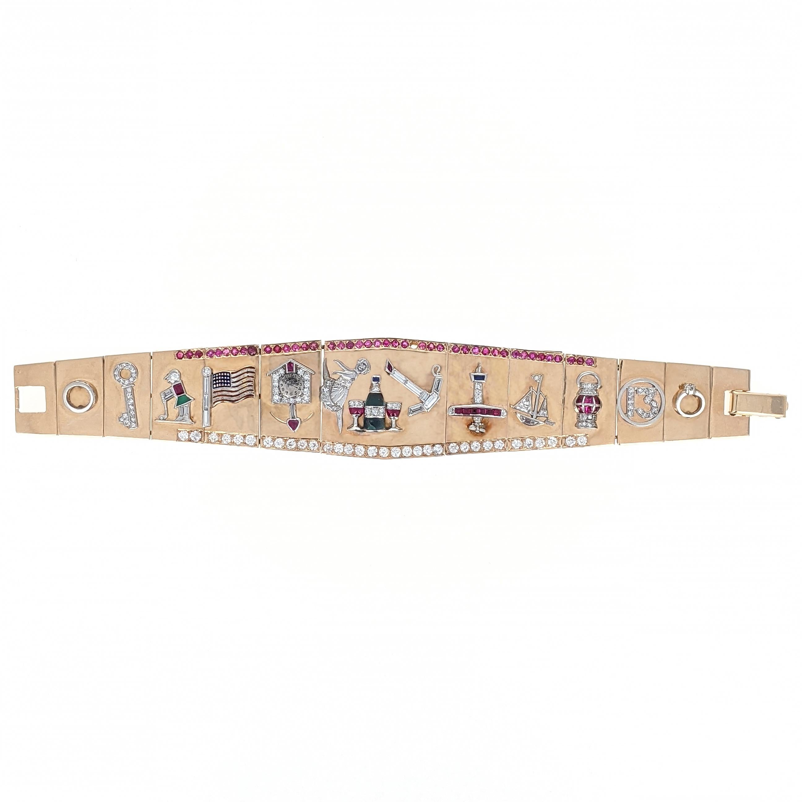 This unique retro charm bracelet is designed as a line of flat links in graduating size, the top accented with a line of round-cut rubies and the bottom accented with old-European cut diamonds. The bracelet features 13 Art Deco period charms: an