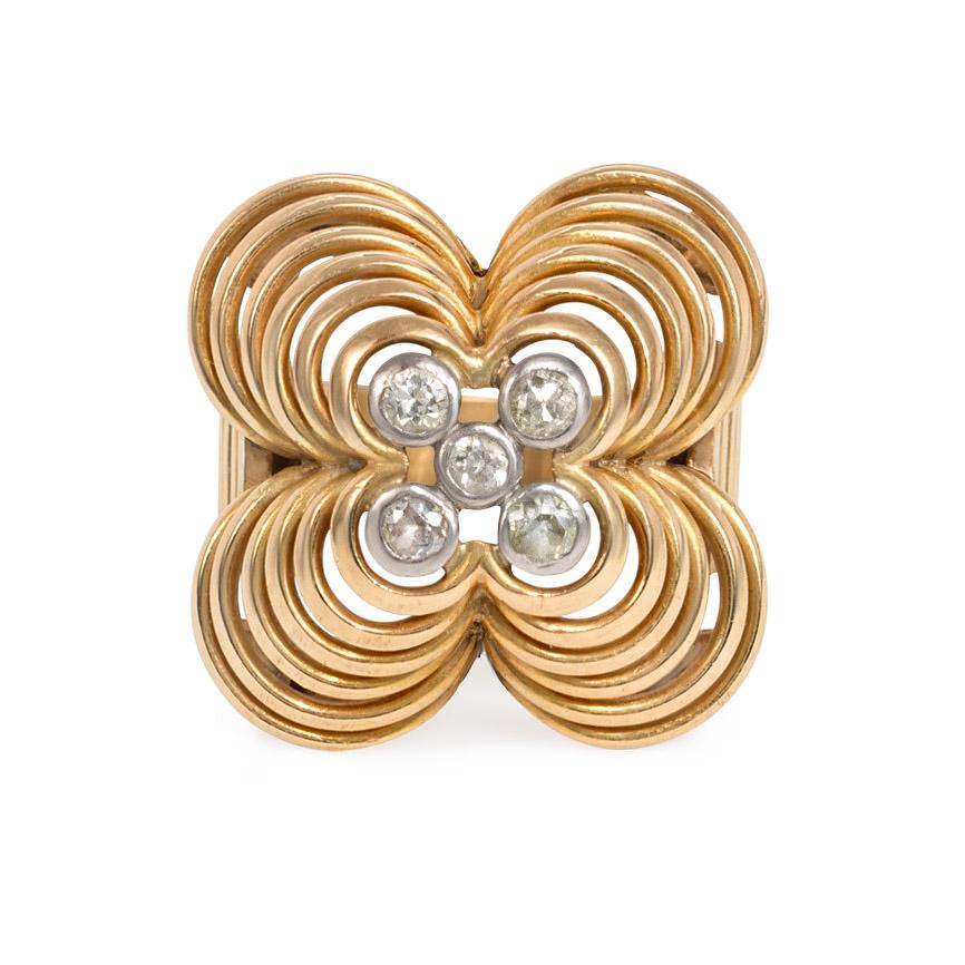 A Retro gold, platinum, and diamond ring featuring a wirework flower form of quatrefoil design, accented with platinum-set diamonds, and completed by a tapered and reeded band, in 18k.  French import.  Atw 0.25 ct.

Face-up dimensions: 7/8 x 7/8

In
