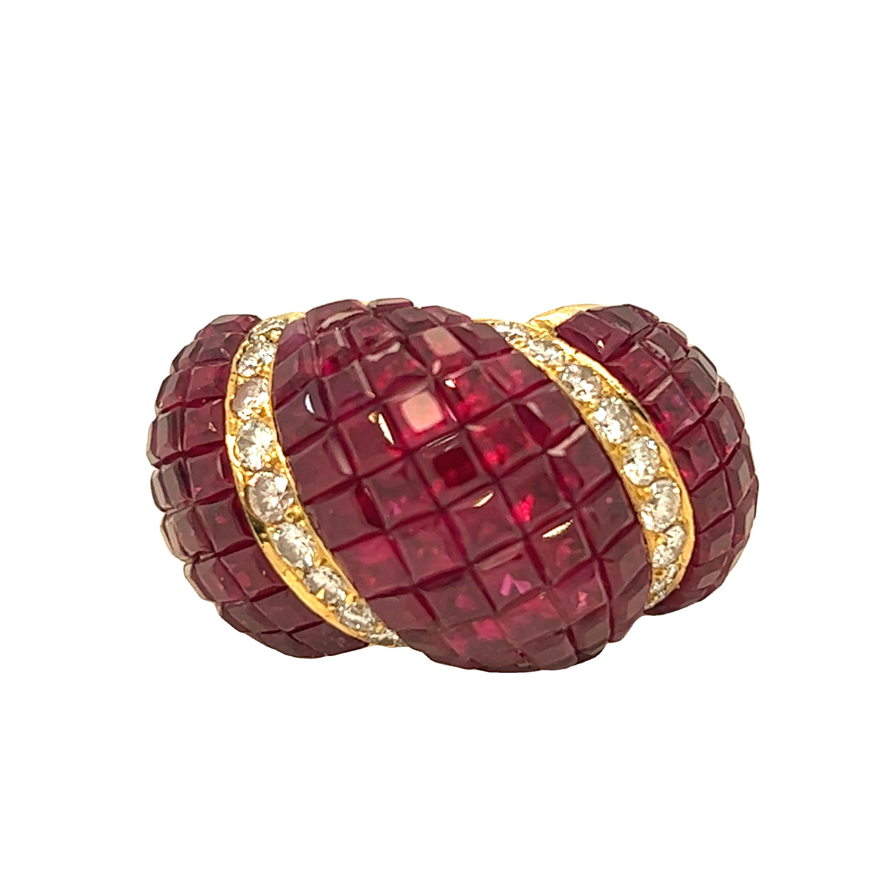 A stunning Retro ring showcasing a cluster of pigeon blood colored rubies, invisible set in a concave dome, ribbon like mounting 18k yellow gold. Small colorless diamonds beautifully accent the ring. 116 pigeon blood rubies weigh approximately 8