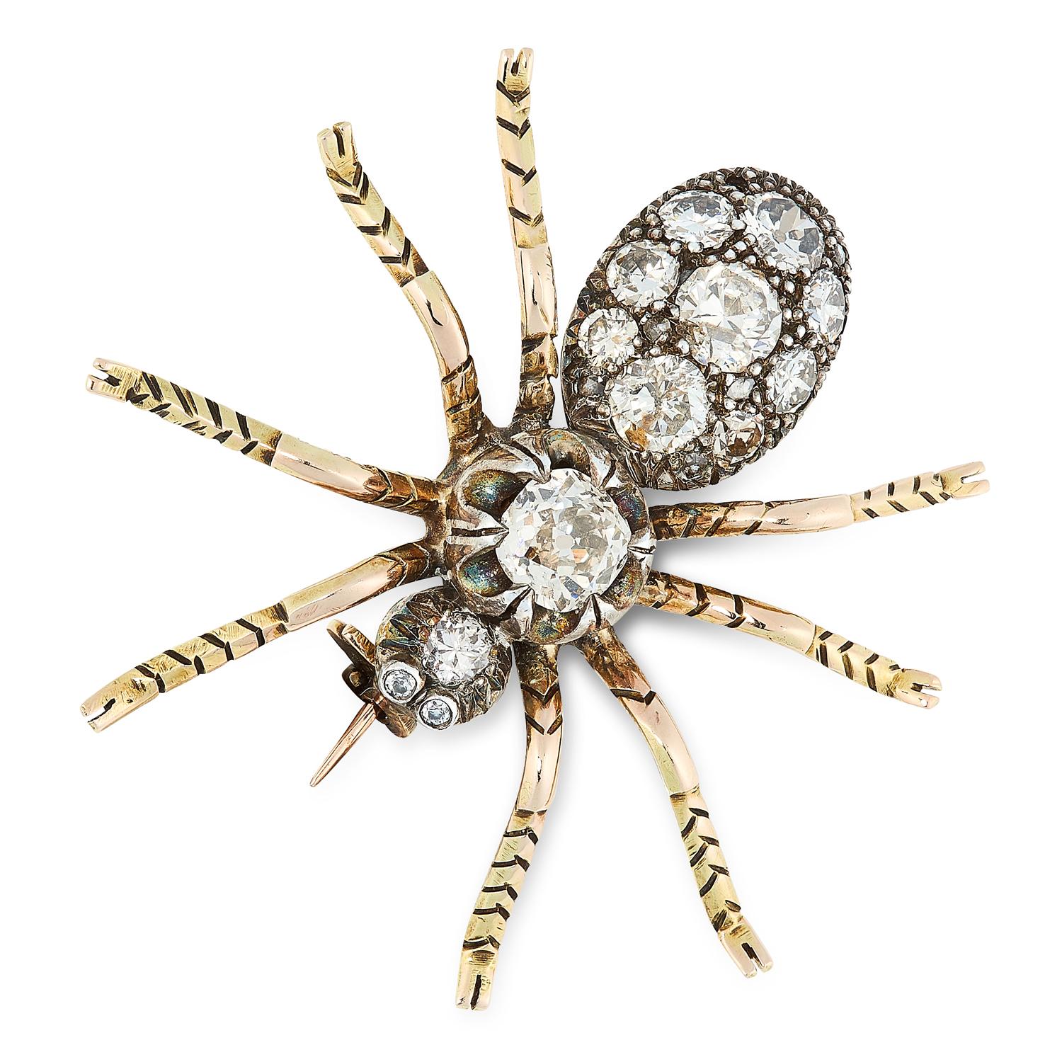 A Retro old cut diamond tarantula spider brooch in silver and yellow gold, 1940s. This Victorian-style early 20th century jewel is modeled as a 3-carat diamond-set tarantula, the thorax composed of a collet-set Old Mine-cut diamond, the head