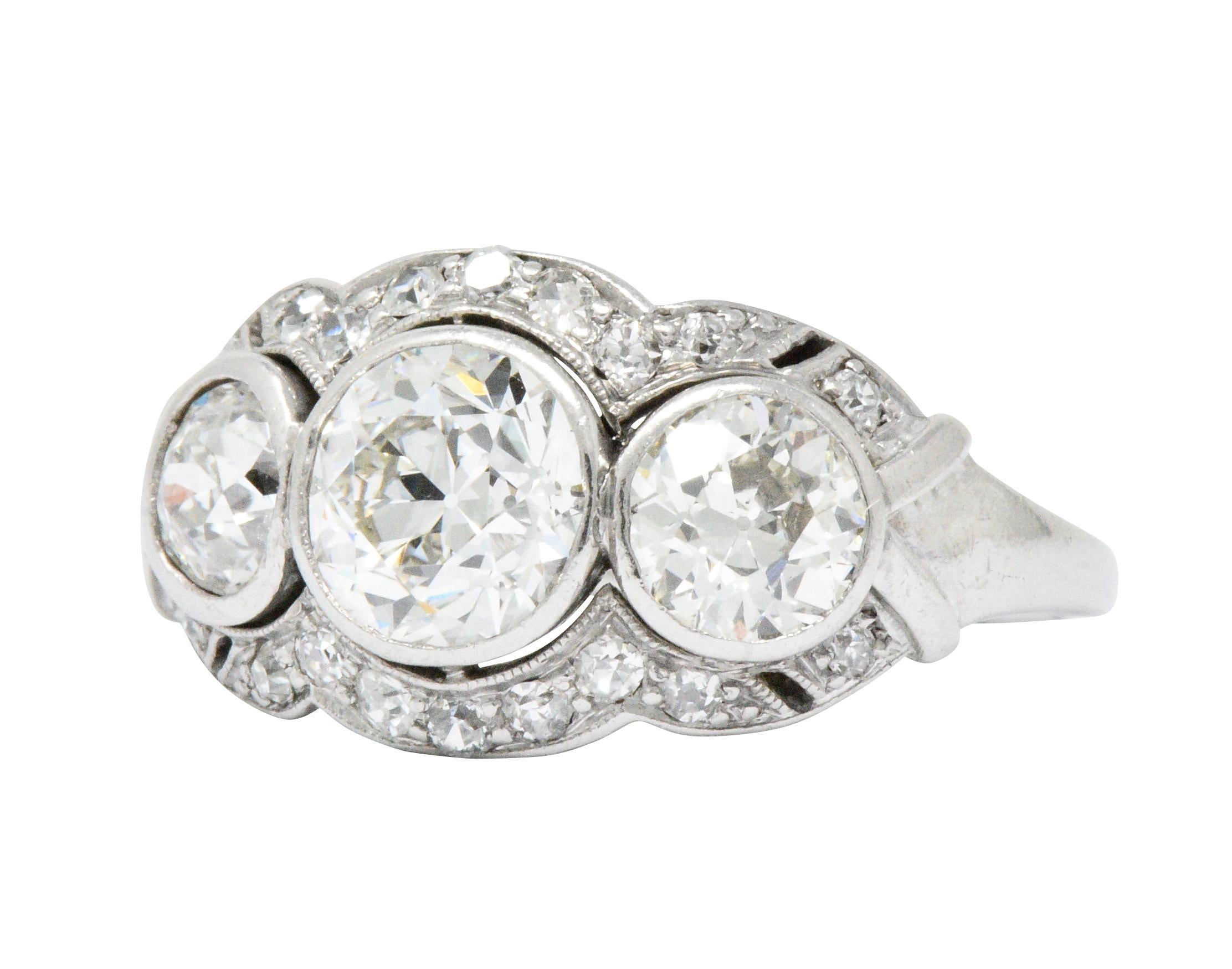 Centering an old European cut diamond weighing approximately 1.25 carats, J color and VS1 clarity

Flanked by an old European cut diamond on each side weighing approximately 0.50 J/K color with SI1 clarity, and 0.60 carats I/J color with VS2