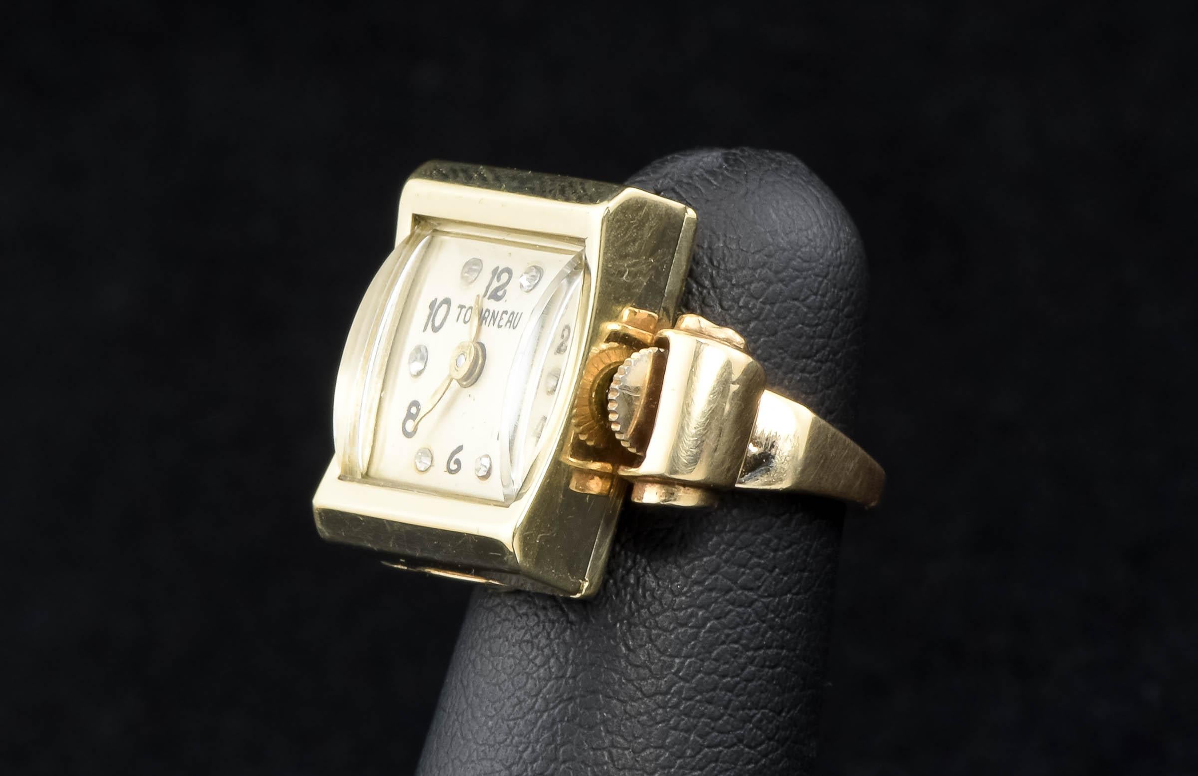 With great retro 1940's to Mid Century style, this solid gold watch ring was originally offered by fine watch retailer Tourneau.

Crafted of solid 14K gold, the watch has a chunky gold band and a curved crystal that really gives it great period