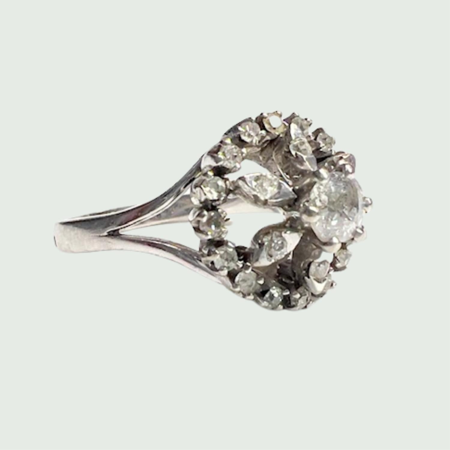 Introducing a truly exceptional piece: the Retro Design Ring featuring a vintage Rosette from the 1945-1950 era, meticulously crafted in 18k white gold. Adorned with brilliant-cut diamonds totaling 1.70 carats, this ring radiates and