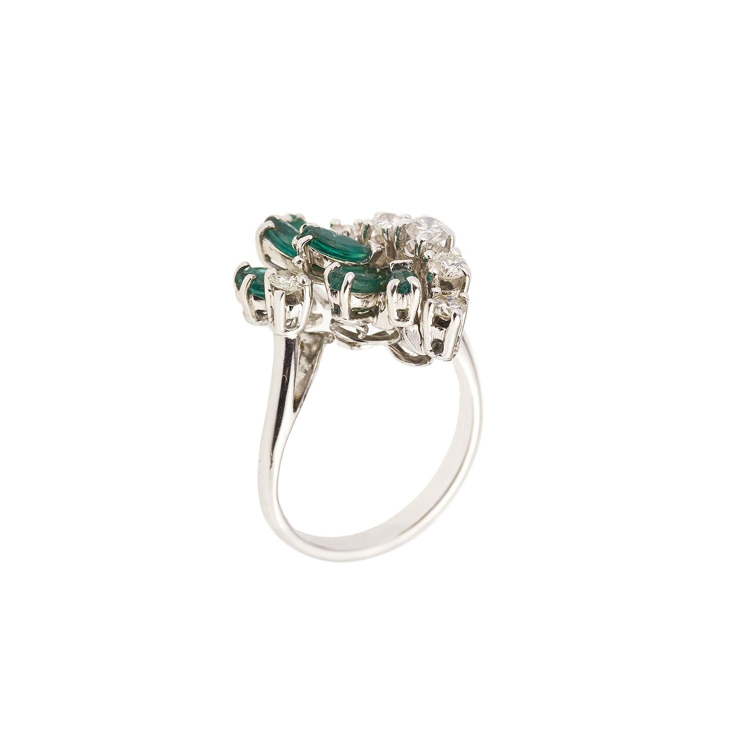Beautiful ring set with 6 marquise cut emeralds and 6 brilliant cut diamonds.

18K white gold, 750 / 000th (eagle's head hallmark)

Diamonds weight: approx 0.40 carats

Weight of emeralds: approx 0.60 carats

Size of the ring : 51 (FR) / 5.5