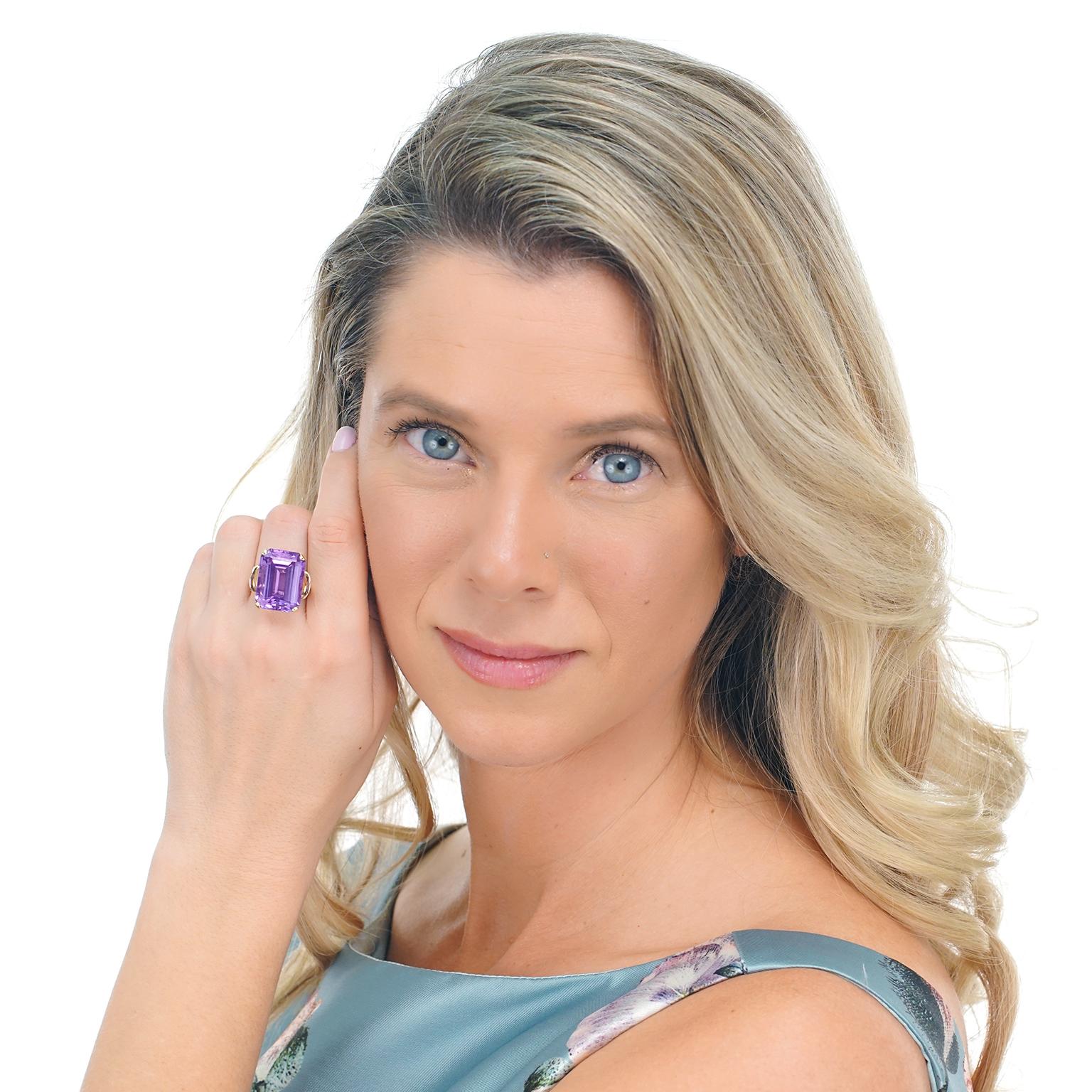 Circa 1950s, 14k, American. Today's big and bold colored-stone looks find their genesis in fashion-forward fifties rings like this one. Set with a charming lilac hued 18.93 carat amethyst and adorned with understated retro details, the look is easy,
