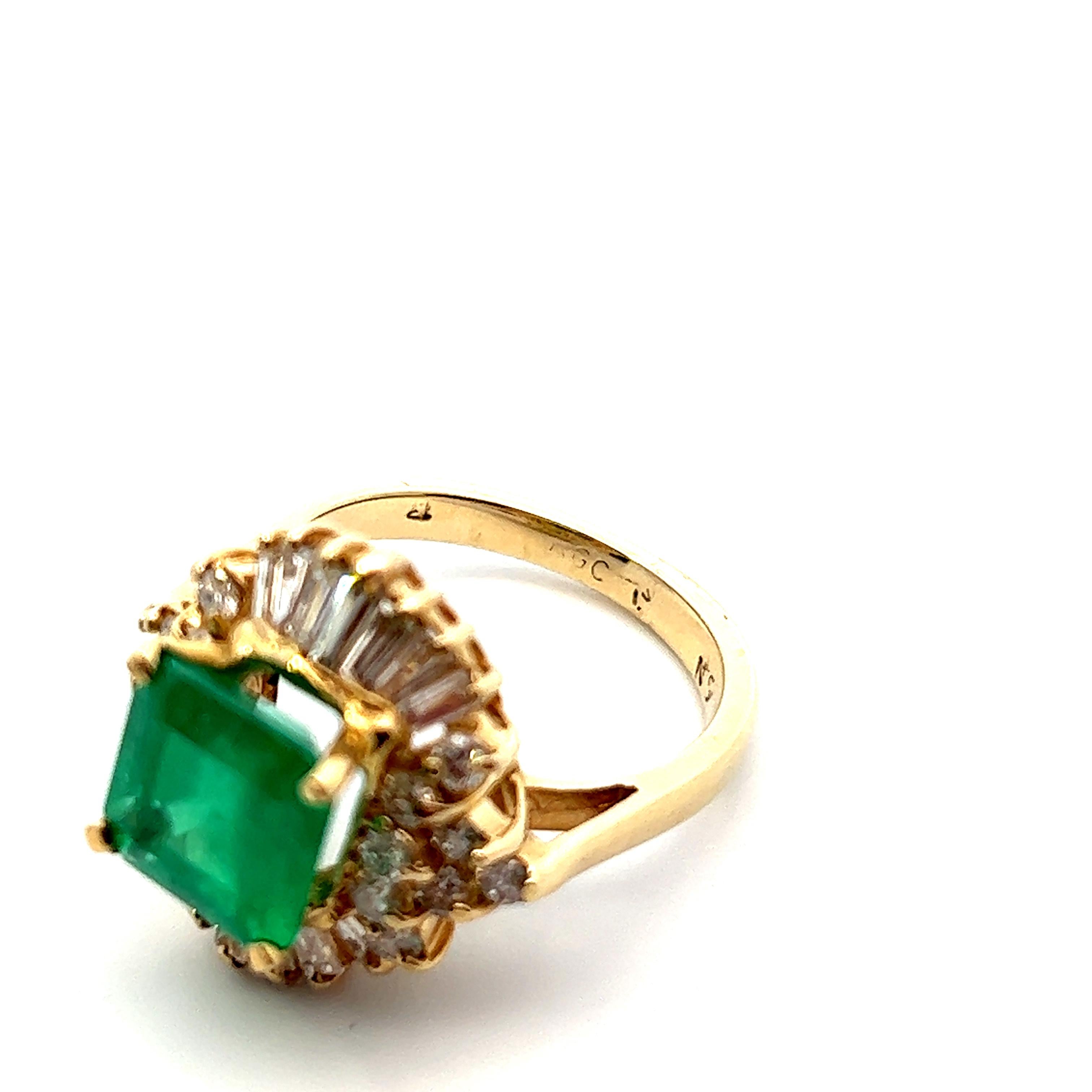 This beautiful Retro ring from the 1960s features both emerald and diamond, as well a 14k and 18k yellow gold prongs. The tasteful blend of emerald and diamond creates a fashionable statement ring that captivates attention. Emerald is known as the