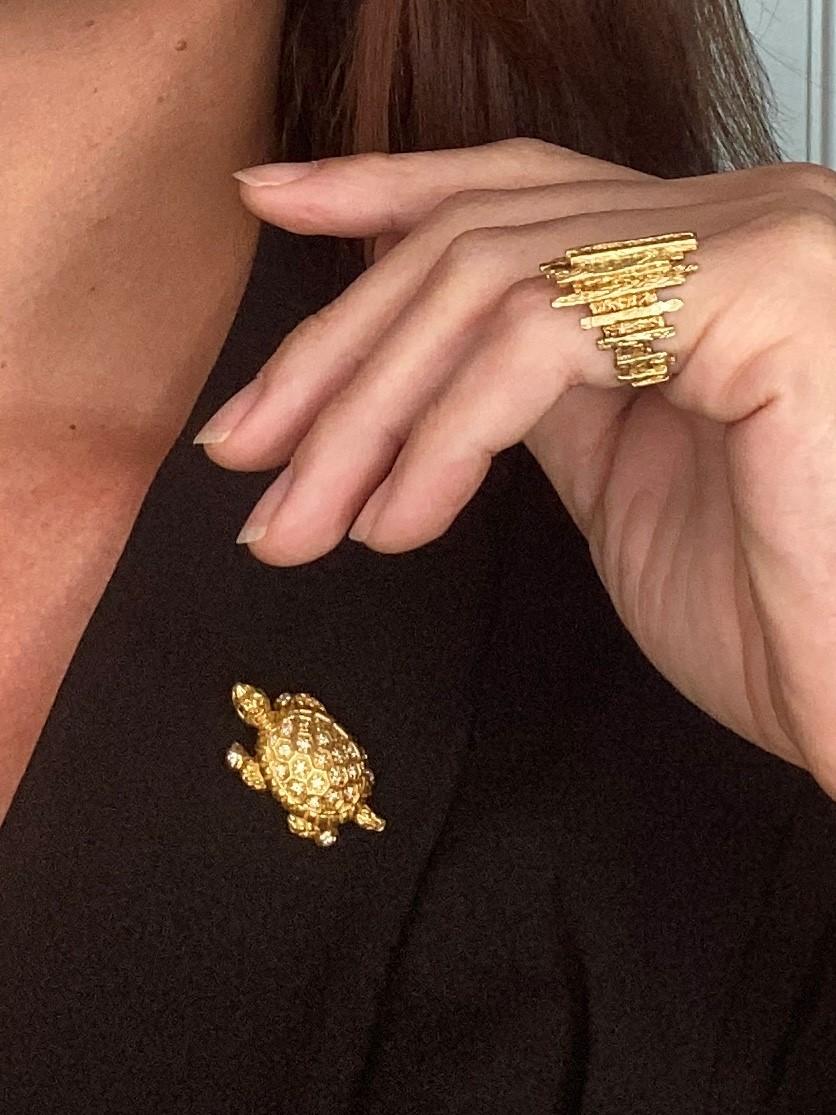 Convertible ring into brooch in the shape of a turtle.

An unusual vintage piece, created during the post war and the mid-century periods, back in the 1950-1960. This ring has been very well crafted in the shape of a sea turtle in solid yellow gold