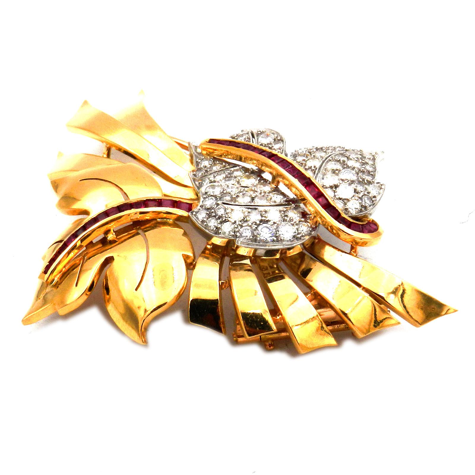 Retro 2.1 ct Diamond Ruby Leaf Brooch in 18K Gold and Platinum circa 1945

Very representative diamond brooch, naturalistically designed in the form of two superimposed maple leaves, whereby the smaller one is set with 69 radiant brilliant-cut