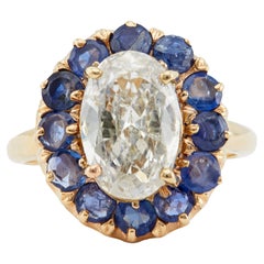 Retro 2.23 Carat Oval Cut Diamond and Sapphire 14k Rose Gold Cluster Ring