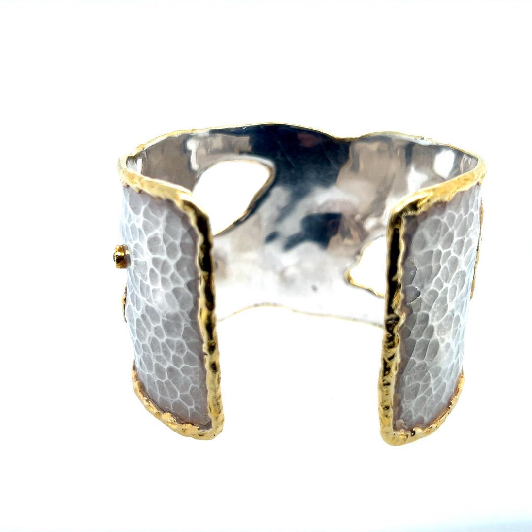 Magnificent 22k Yellow Gold and 925 Silver Cuff Bracelet set with seven round rose cut sliced diamonds weighing approximately 3 carats total. The silver portion finished with stunning hammered look craftsmanship.

It measures 1.75” inches wide and