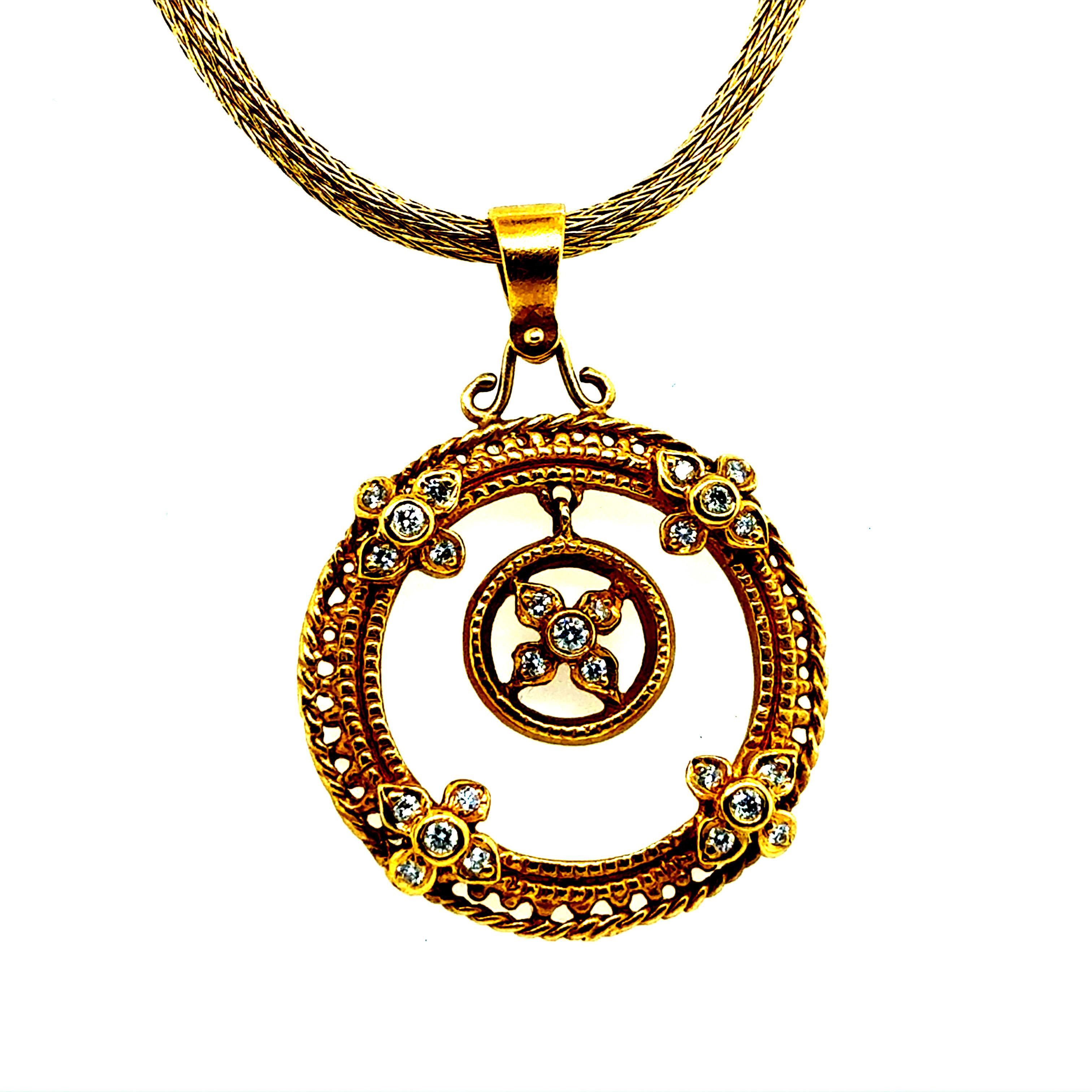 Retro 22K yellow gold pendant set with 25 natural round brilliant diamonds totaling approximately 0.45 carats. The pendant measures about 1 inch in diameter and weighs 9.5 g. It is paired with a 14K yellow gold chain measuring 16 inches in length,