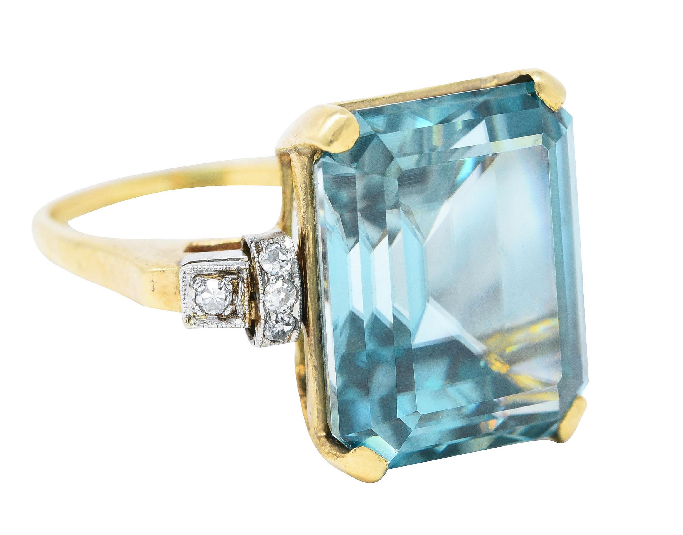 Ring centers a wide prong set emerald cut zircon weighing approximately 24.00 carats total

Transparent and strongly greenish blue in color - eye clean

Accented by cathedral shoulders with scrolled platinum forms bead set with round single cut