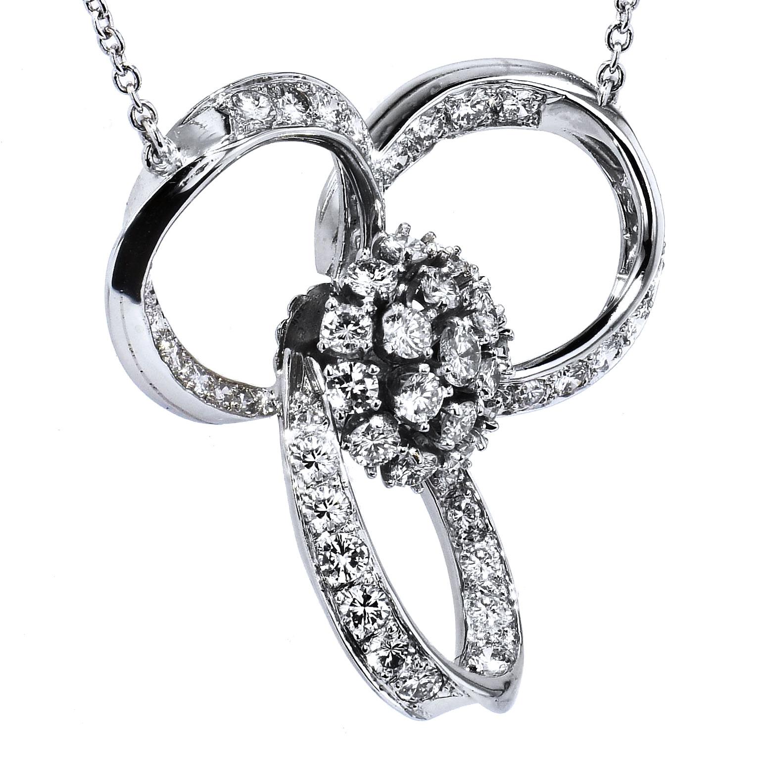 Retro 2.50 Carats of Diamond Triple Loop Platinum Pendant Necklace

Enjoy this previously loved Retro era platinum and diamond pendant. Loops of platinum accented with 2.50 carat of round diamond (H/VS/SI) swoop together to form three oval bows
