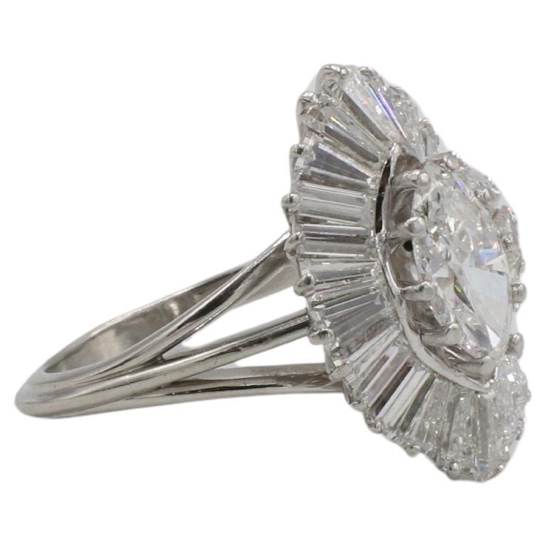 Retro 2.80 Carat Natural Marquise & Baguette Diamond Platinum Ballerina Cocktail Cluster Ring 

Metal: Platinum
Weight: 8.44 grams
Center diamond: Approx. 1.30 carat marquise natural F VS1 diamond
Accent diamonds: Approx. 1.50 carats G-H VS tapered