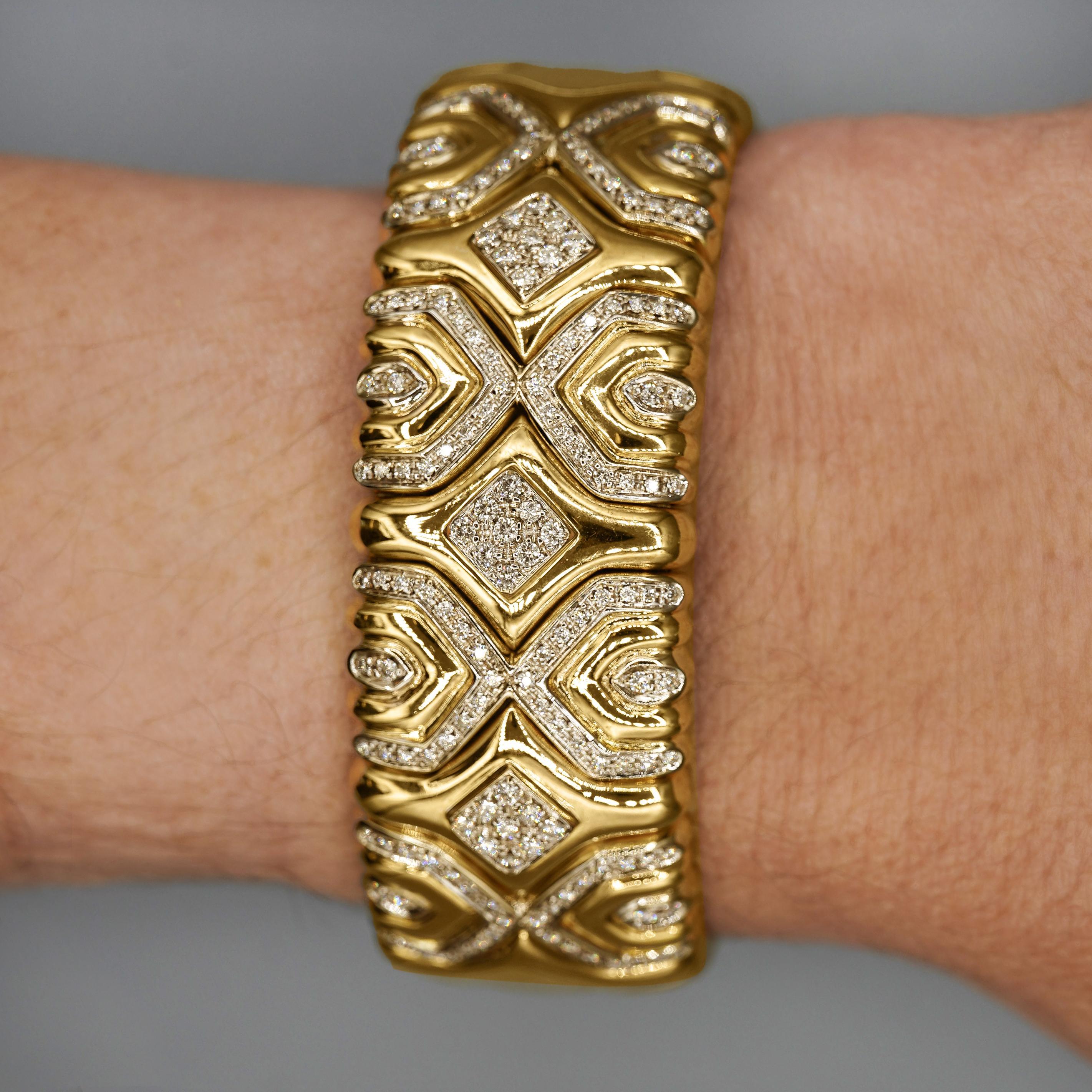 18K Yellow gold retro inspired vintage geometric bangle bracelet. Set with 3 carats of round cut white diamonds. 23.5mm, fits 6.5-inch wrist, max 7-inch).

Details:
Item Type: Cuff Bangle
Metal: 18K Yellow Gold
Size: 2.1