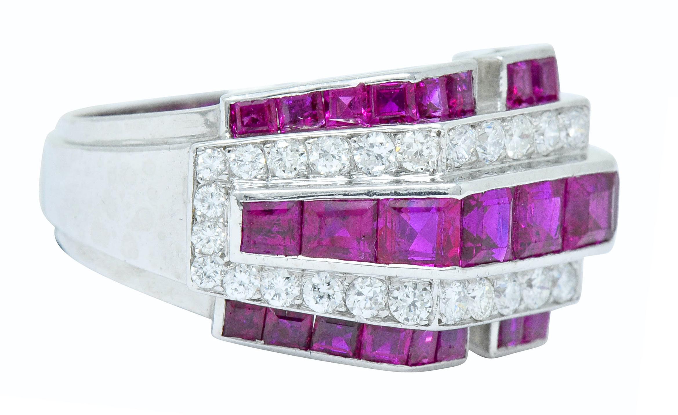Band ring is designed as stepped horizontal rows of rubies alternating with rows of diamonds

Rubies are channel set and a well-matched purplish-red color, weighing approximately 2.20 carat total

Diamonds are bead set and weigh in total