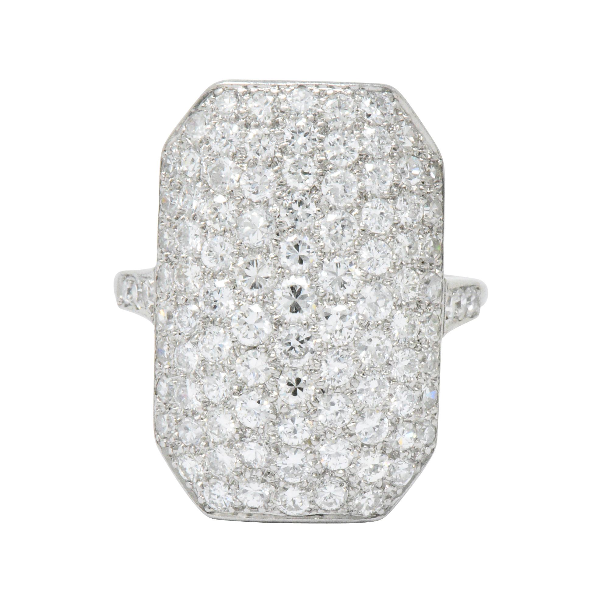 Featuring a cut-corner rectangular top with pavé set transitional cut diamonds and diamonds on the shoulders

Total diamond weight approximately 3.74 carats, G/H color and VS clarity

Pierced and scrolling detailed gallery

Unique ring with abundant