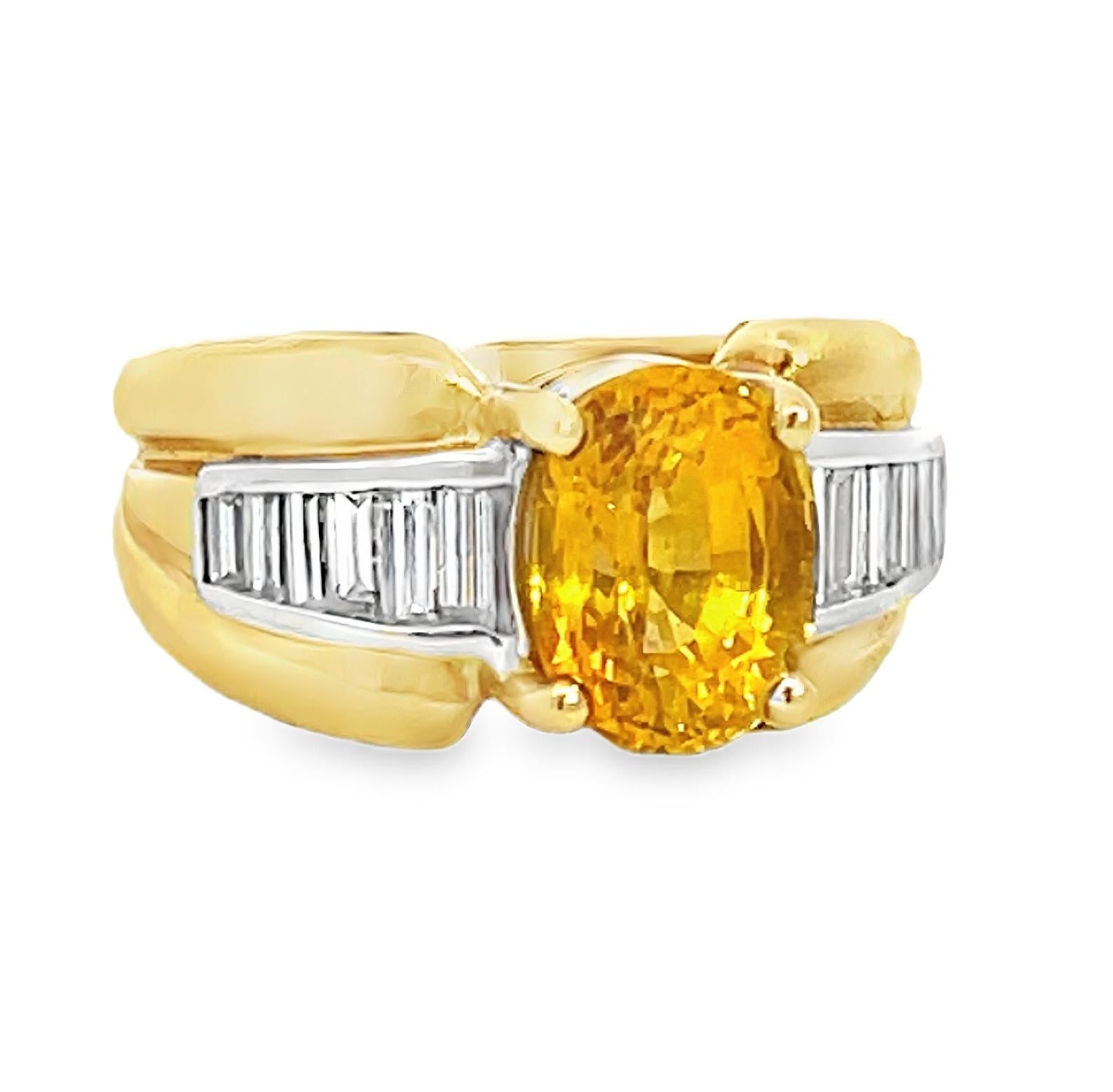 Vintage retro cocktail ring featuring a vibrant 3.75-carat yellow-orange sapphire. The rich, golden hues of the oval-shaped sapphire are beautifully complemented by 12 bright white baguette diamonds, totaling 0.30 carats, meticulously channel-set