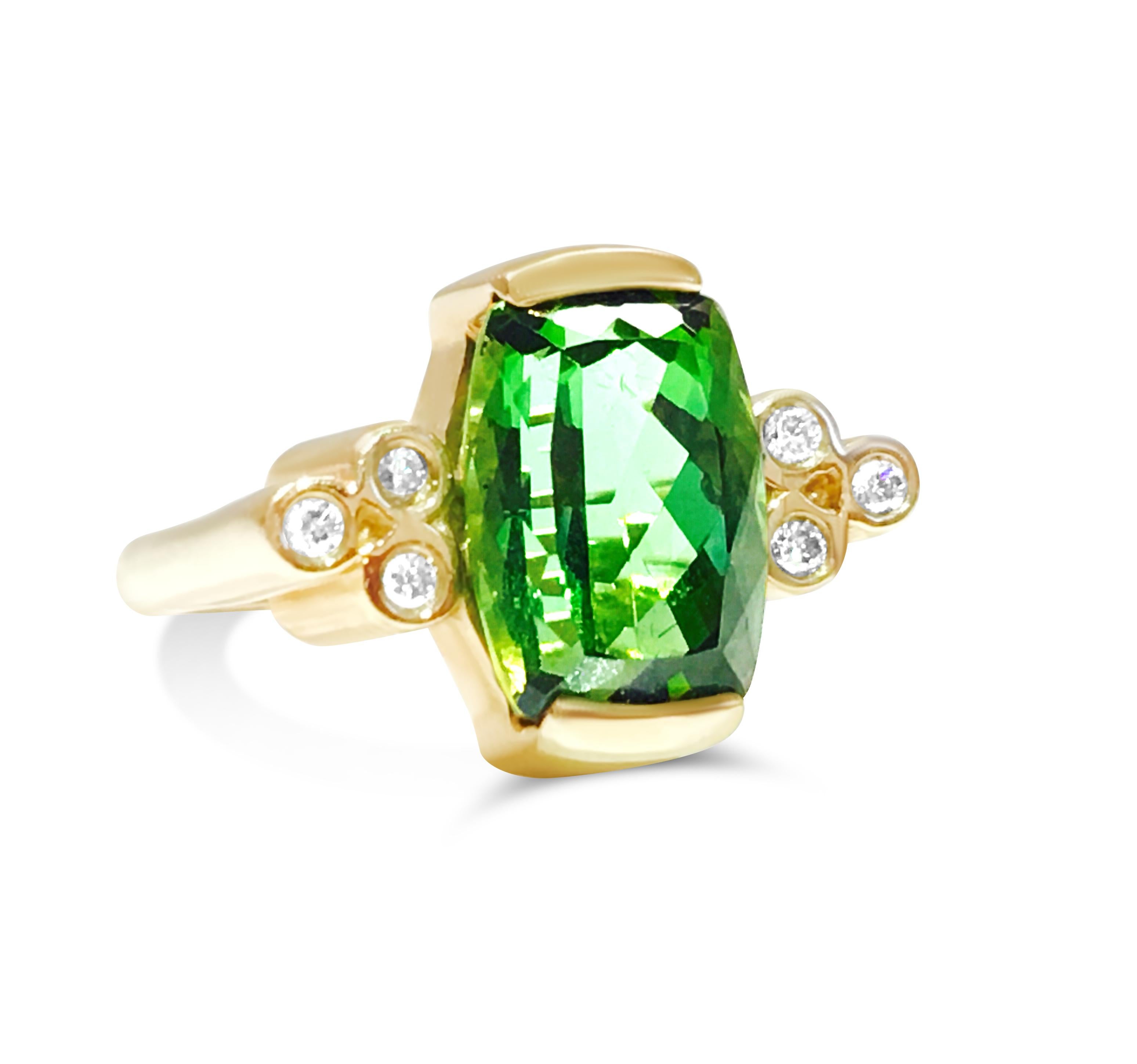 Metal: 14K yellow gold.

Center: 4.00 carat green tourmaline set in channel setting. 100% natural earth mined tourmaline.

0.21 carat side diamonds. VS clarity and F-G color diamonds. 100% natural earth mined and genuine diamonds. Extremely