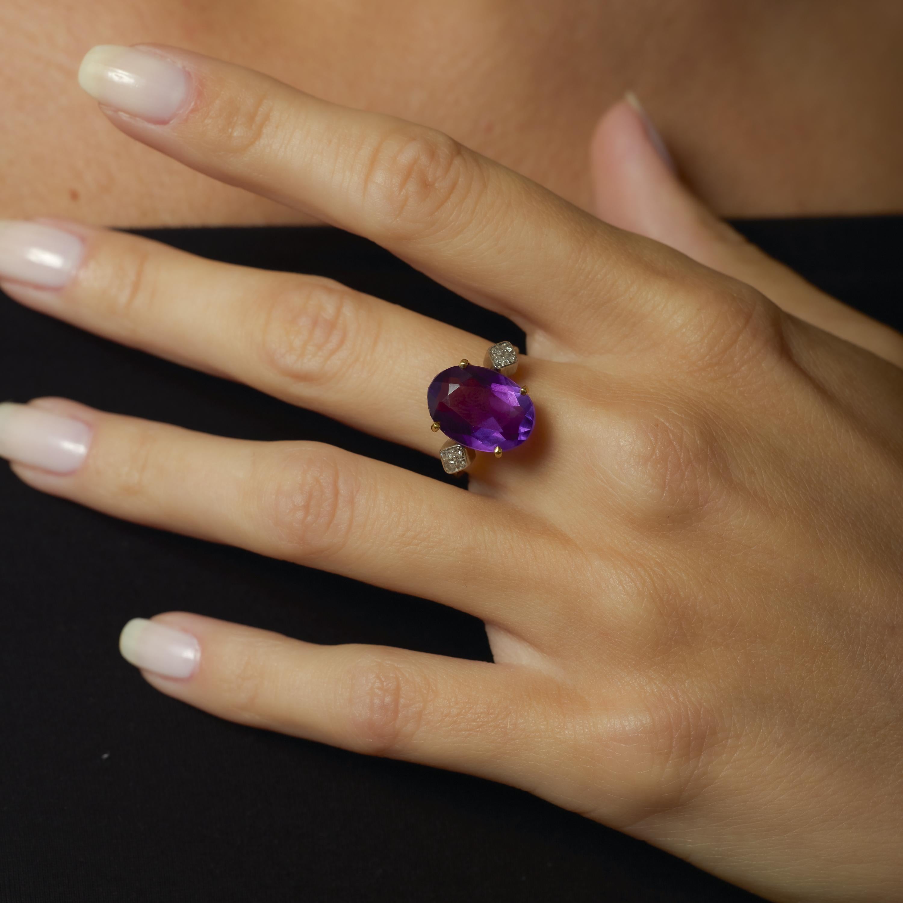 This Retro 18k yellow and white gold ring highlights a vibrant 5 carat amethyst, framed by sparkling single cut diamonds for a colorful, vintage-inspired design.