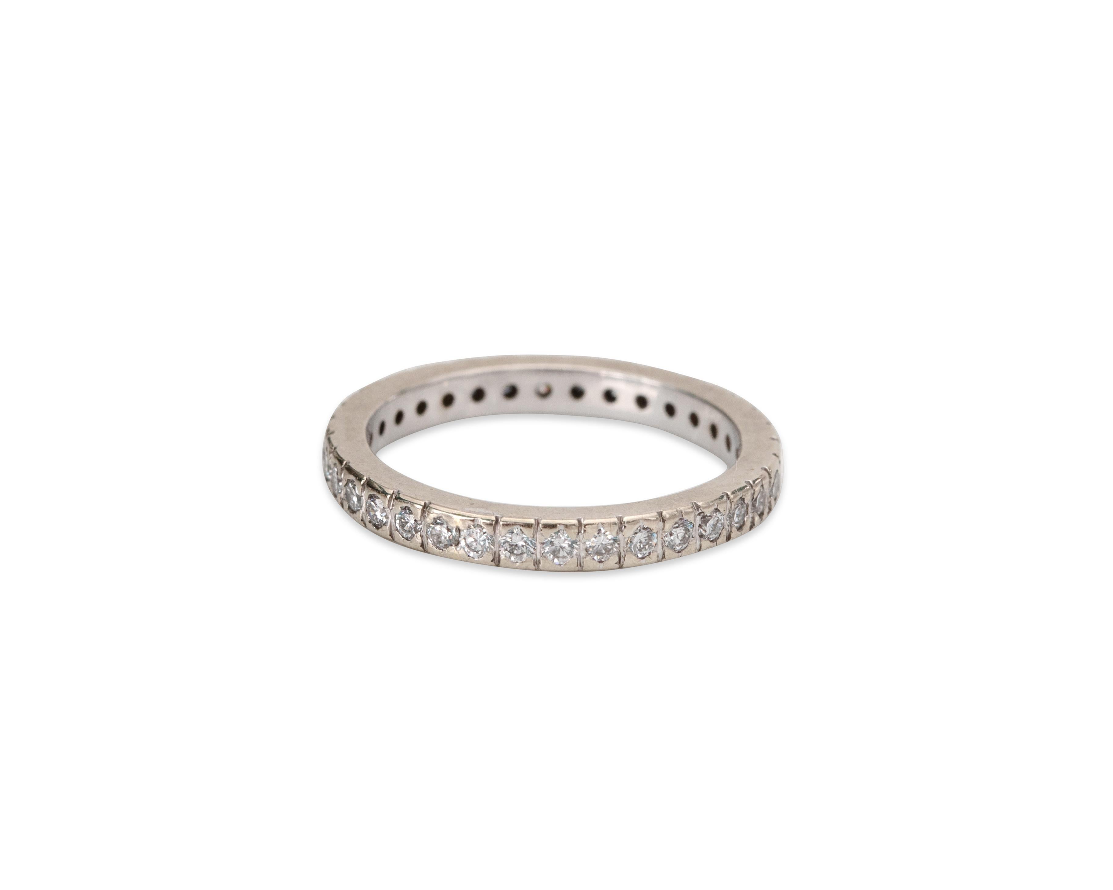 Here we have an 1950's eternity band crafted in platinum! There are a total of 1/2 carats of sparkling round brilliant cuts. The hefty platinum ring will protect the diamonds and provide strength for many years to come! This is a great example of a