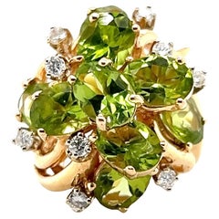 Retro 7.87 Carat Peridot and Diamond Yellow Gold Cocktail Ring 1970s