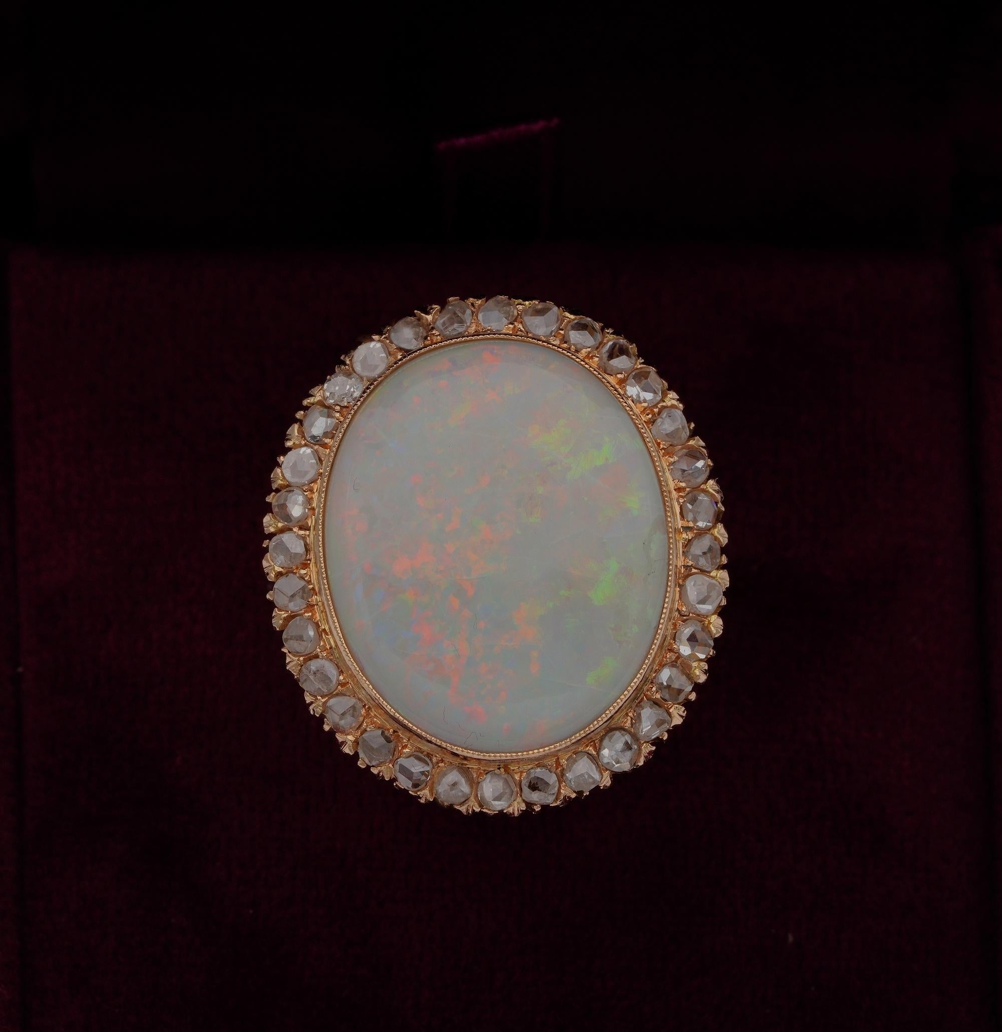 This remarkable Retro Opal & Diamond ring is 1940 ca
Hand crafted in a skillfully manner of solid 18 KT gold
Classy in design consisting in a centre large Opal set in a halo of rose cut Diamonds and lovely leaf open work delineating the sides and