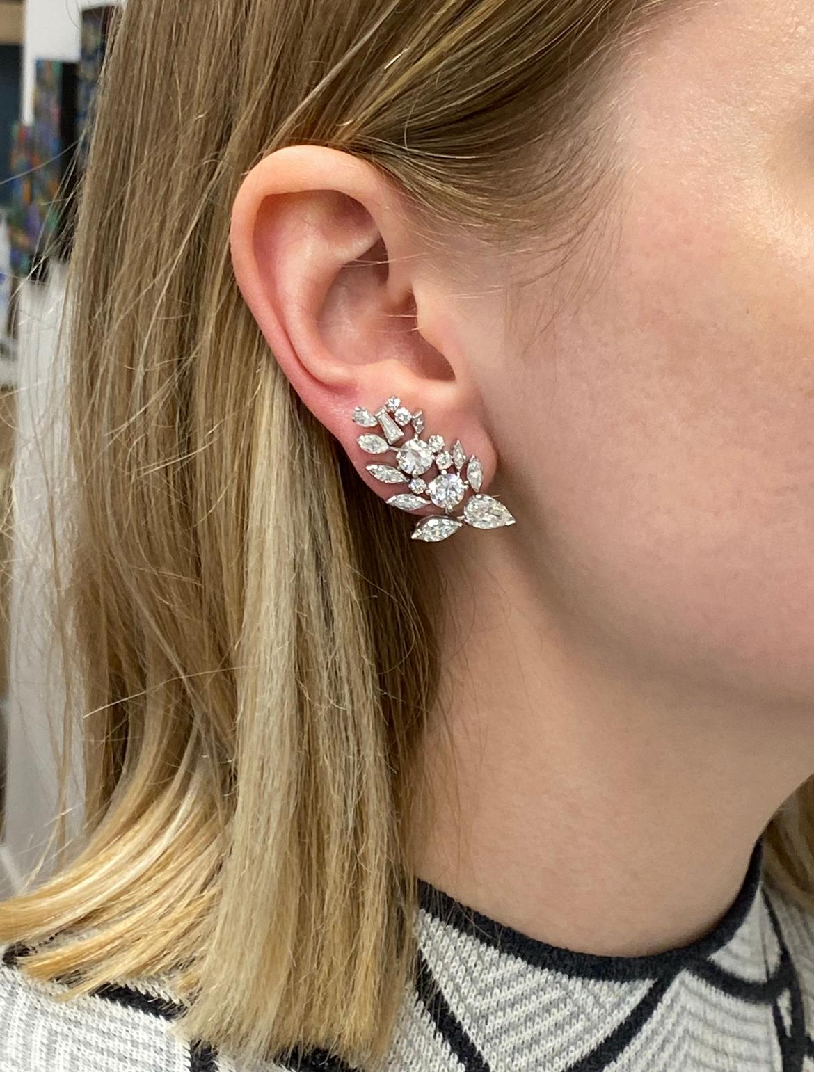 Retro 8.00 Carats Plus Diamond Platinum Ear Clips. The earrings feature 2 antique pears approximately 1.72 carat, 4 Round Brilliant Cuts, approximately 2.80 carat, 10 Round Brilliant Cuts approximately 0.56 carat, 12 marquise approximately 1.70