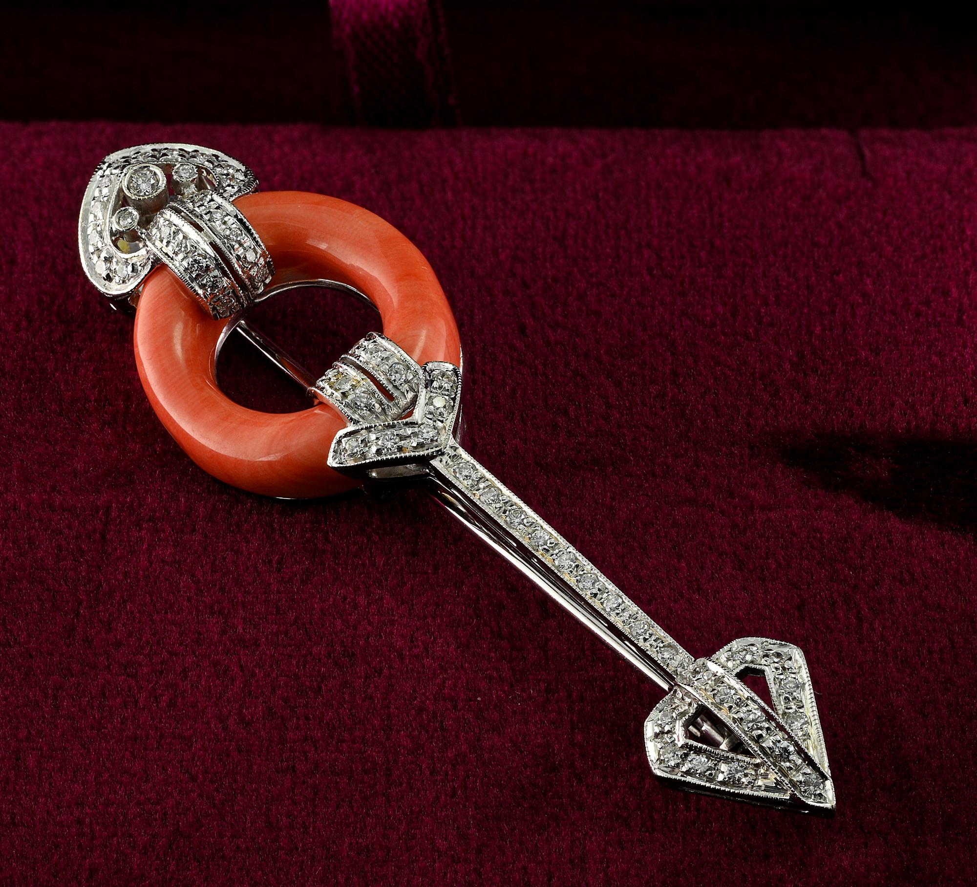 This superb vintage brooch is 1945 ca
Italian origin
Arrow design adorned with a natural Coral element interlaced in between
Set with brilliant cut Diamonds for .95 Ct altogether G VVS
Hand crafted as unique of solid 18 KT white gold
measuring 67 x
