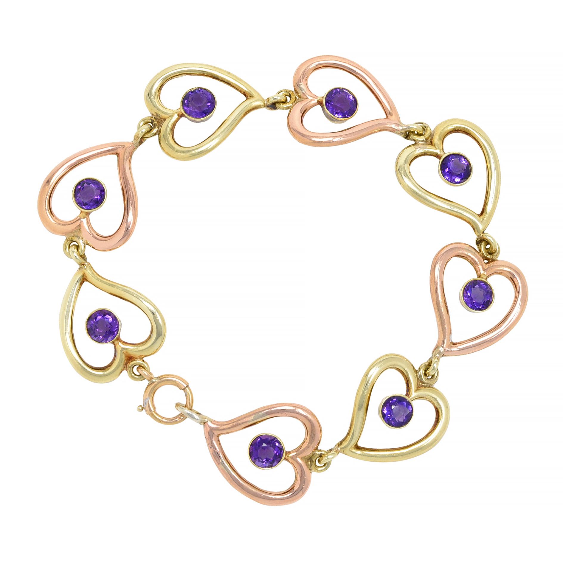 Comprised of pierced heart-shaped links alternating with rose and yellow gold 
Each centering a round cut amethyst - transparent medium purple 
Measuring 5.0 mm round and bezel set
Completed by a spring clasp closure
Stamped for 14 karat gold