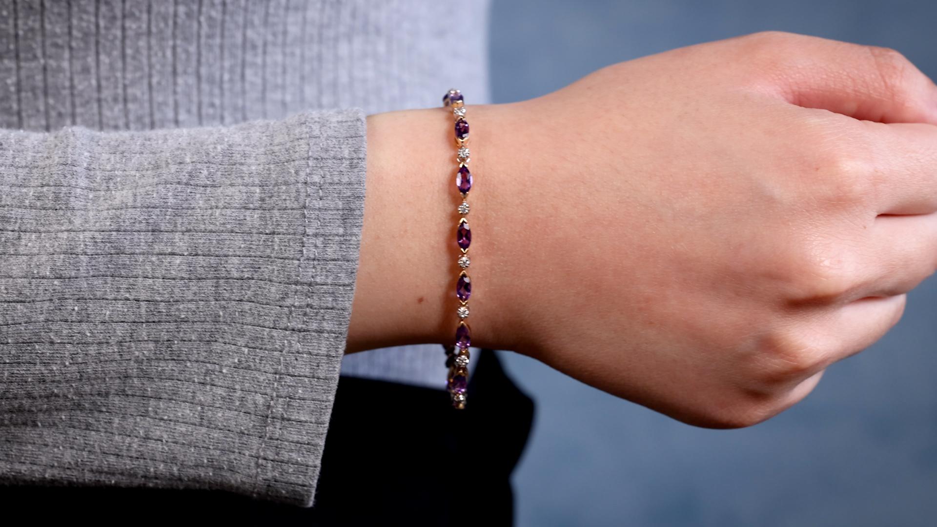 One Retro Amethyst Diamond 14k Gold Bracelet. Featuring 15 marquise cut amethysts with a total weight of 2.35 carats. Accented by 15 single cut diamonds with a total weight of 0.15 carat, graded I-J color, SI clarity. Crafted in 14 karat yellow and