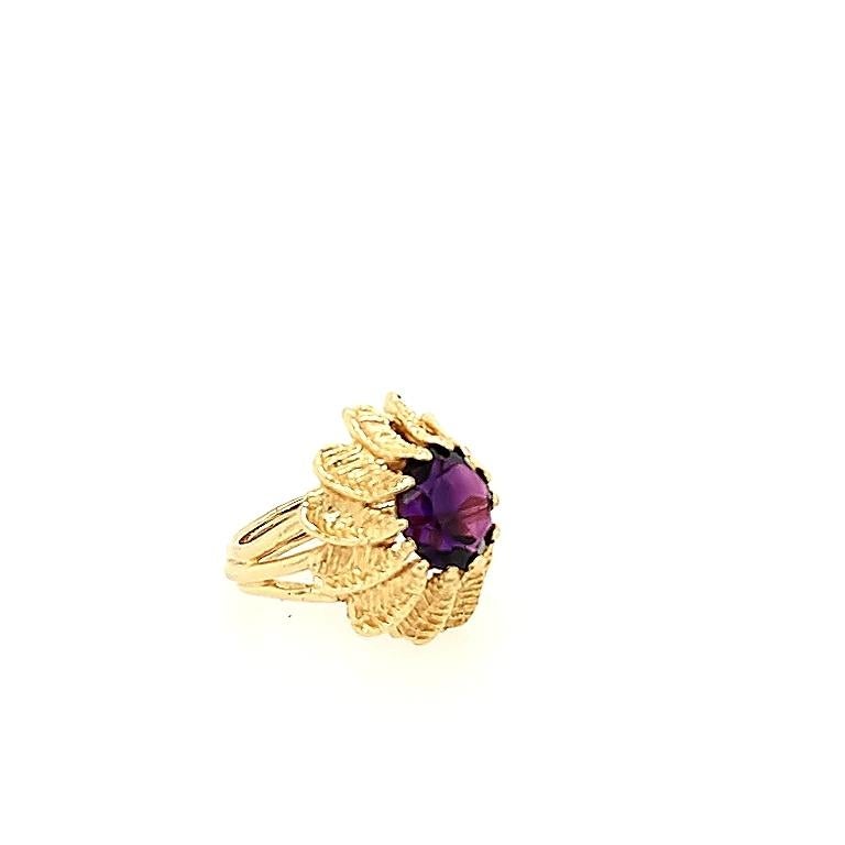 Crafted in 14k yellow gold featuring (1) round amethyst weighing approximately 4-5ct measuring approximately 9mm x 7mm. The ring is a size 6. It weighs 9.4 grams