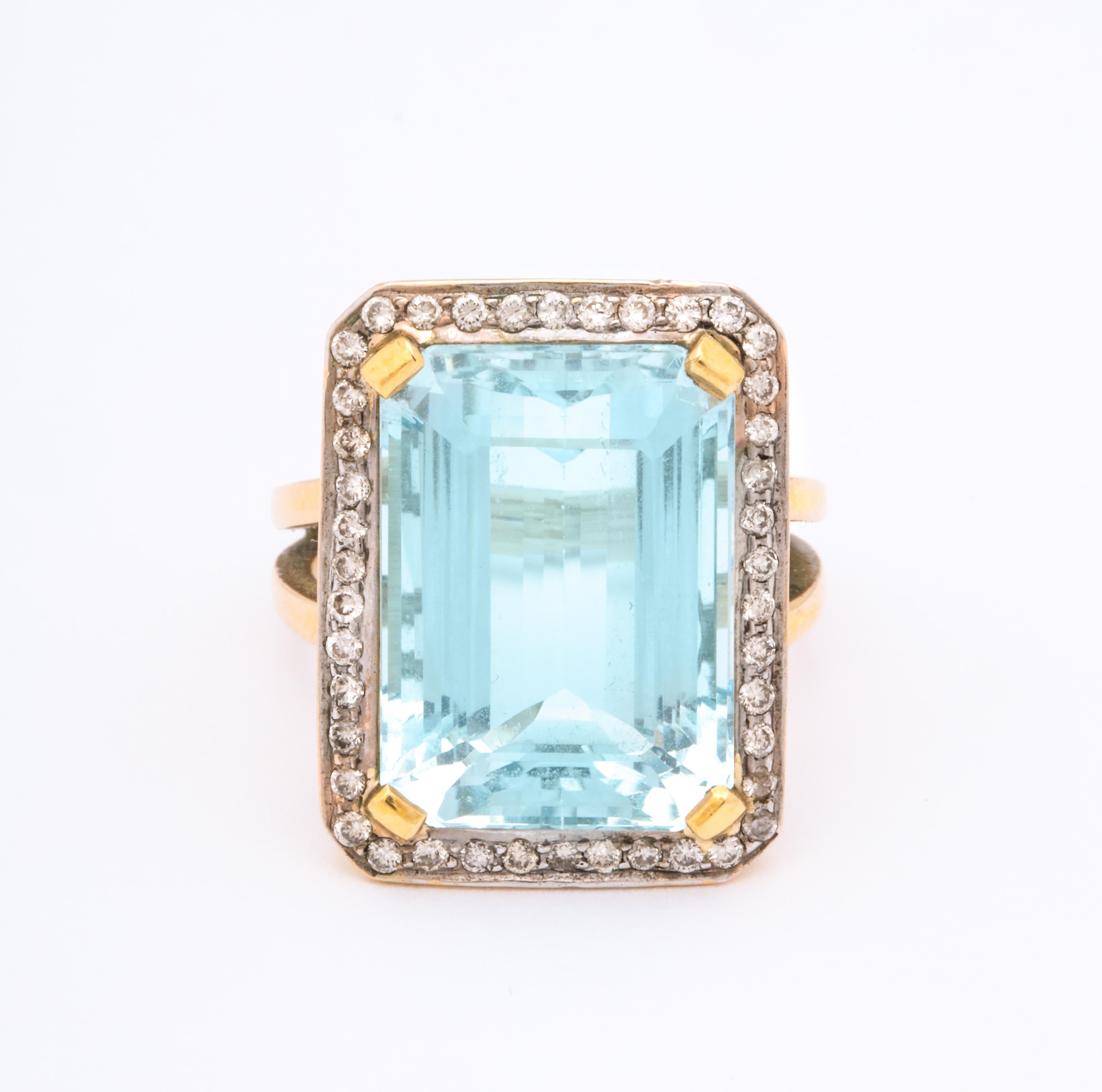 A fantastic 9 ct  Aquamarine ring with a frame of diamonds surrounding this beautiful stone